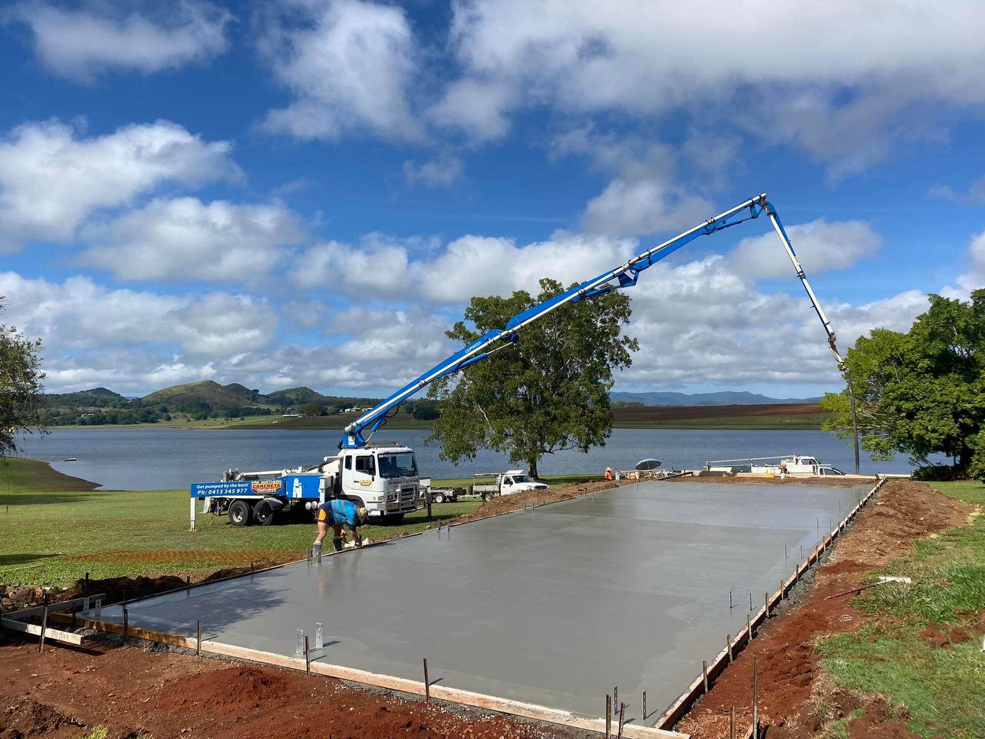 Concrete Pouring at a Lakeside Construction Site — Far Northern Concrete Pumping in Cairns, QLD