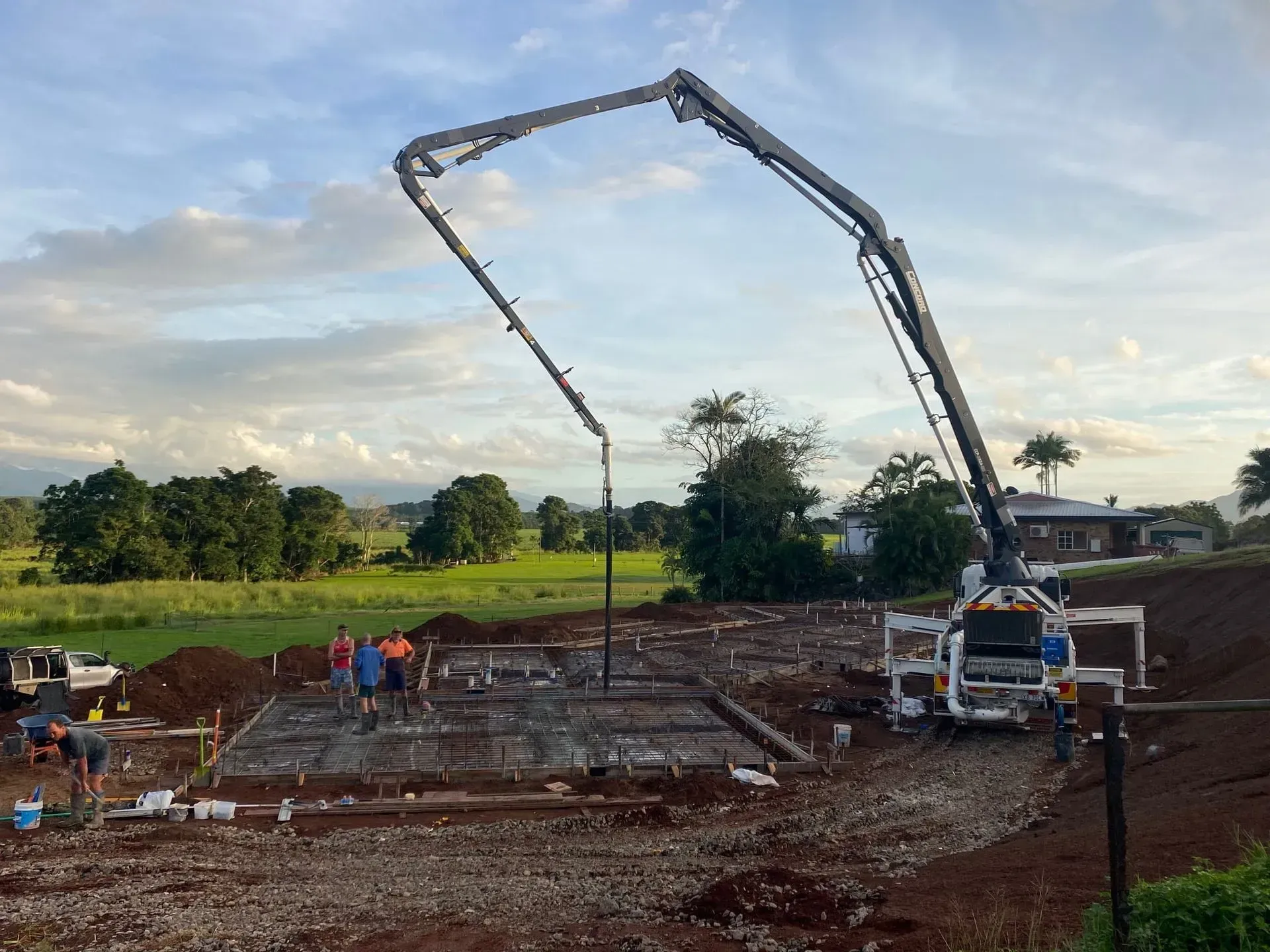 Concrete Pump Truck Pouring Concrete — Far Northern Concrete Pumping in Mareeba, QLD