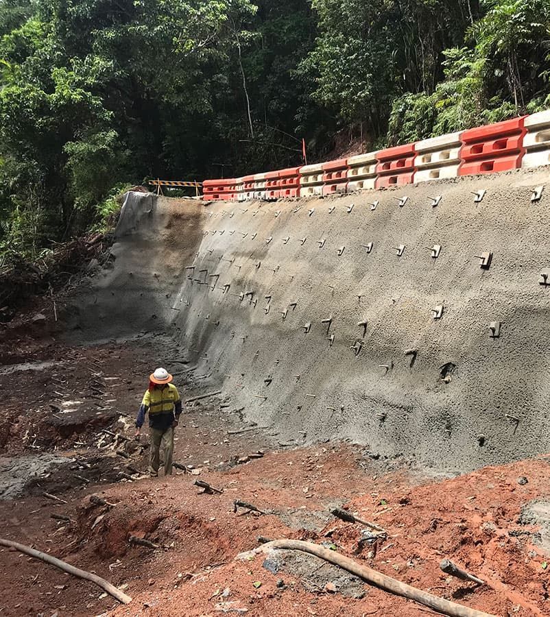 Construction Worker Standing Near a Retaining Wall — Far Northern Concrete Pumping in Mareeba, QLD
