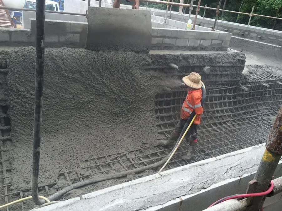 Construction Worker Leveling Wet Concrete — Far Northern Concrete Pumping in Mareeba, QLD