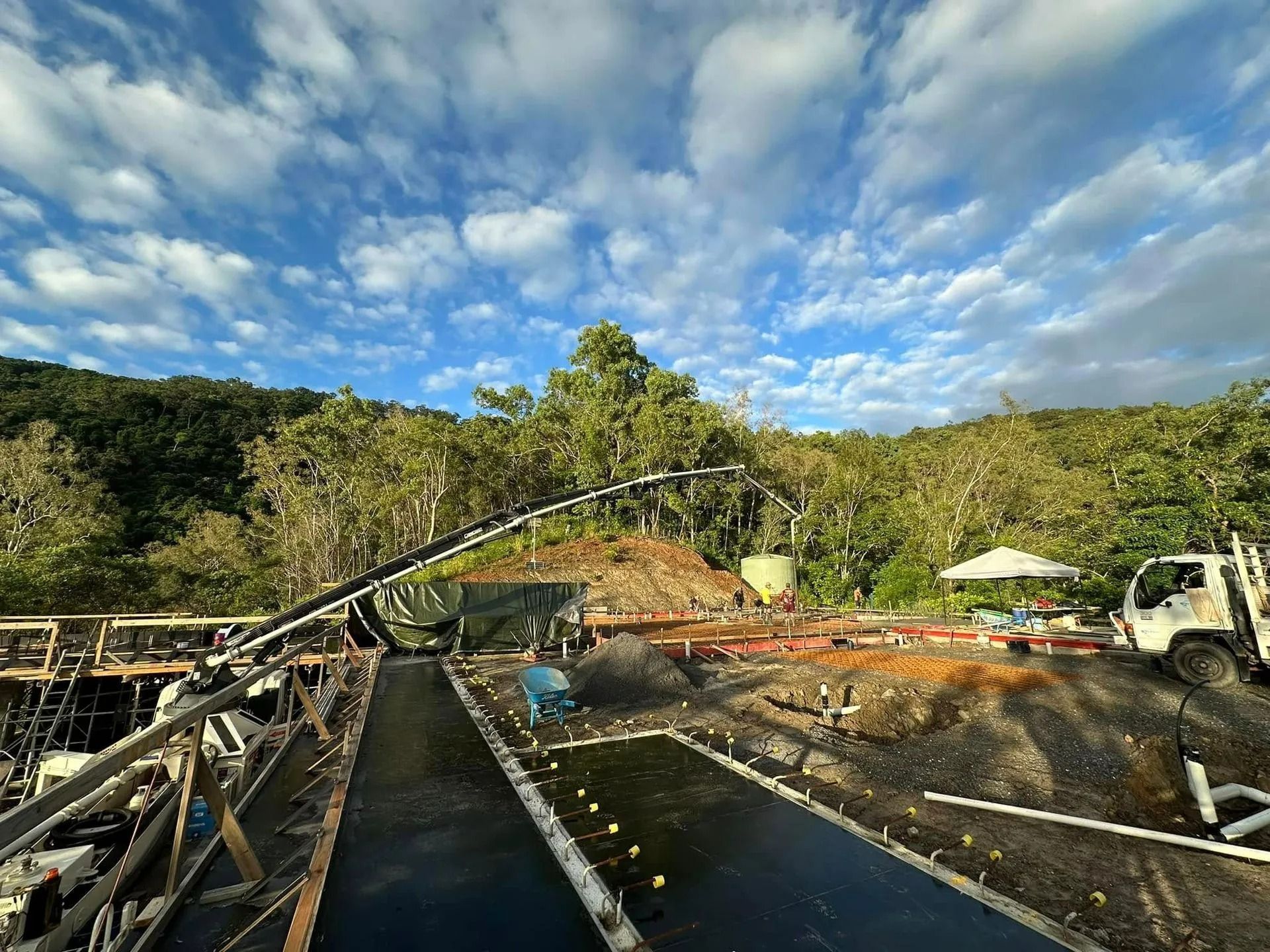 Construction Site With Conveyor Belt Pouring Concrete — Far Northern Concrete Pumping in Croydon, QLD