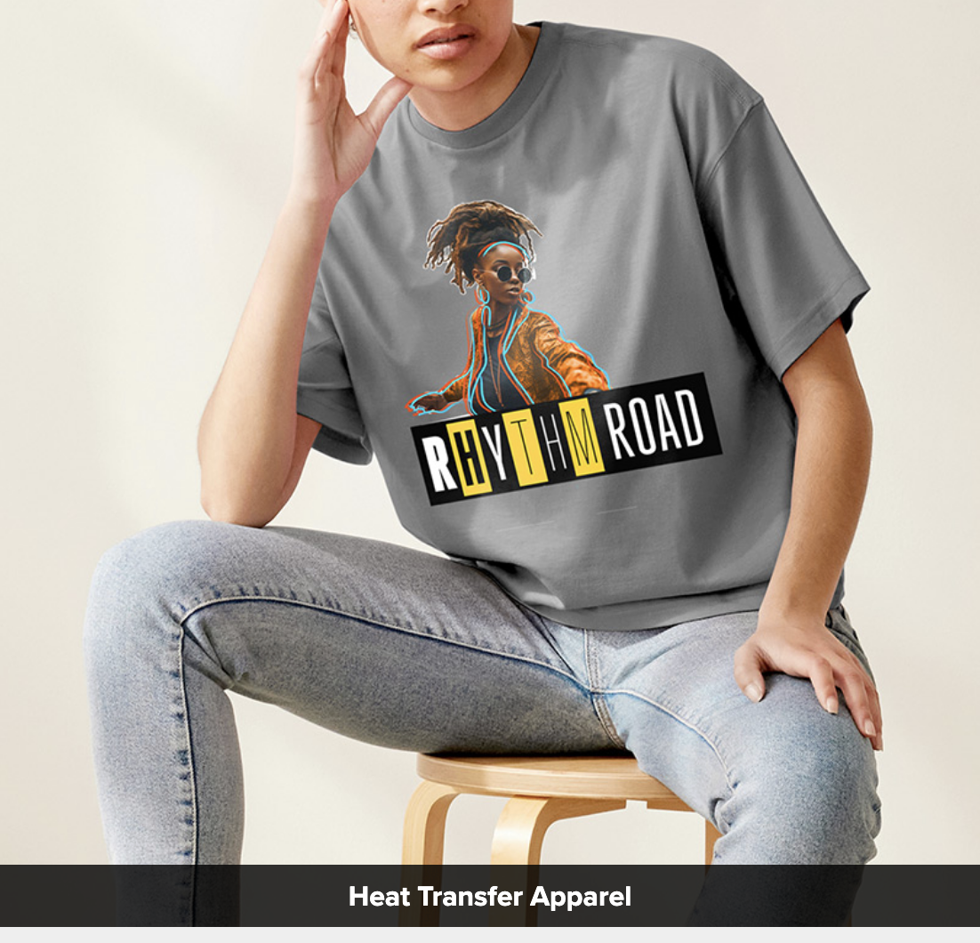 Woman sitting down wearing jeans with a Roland DG BN2-20 print example on a grey shirt.