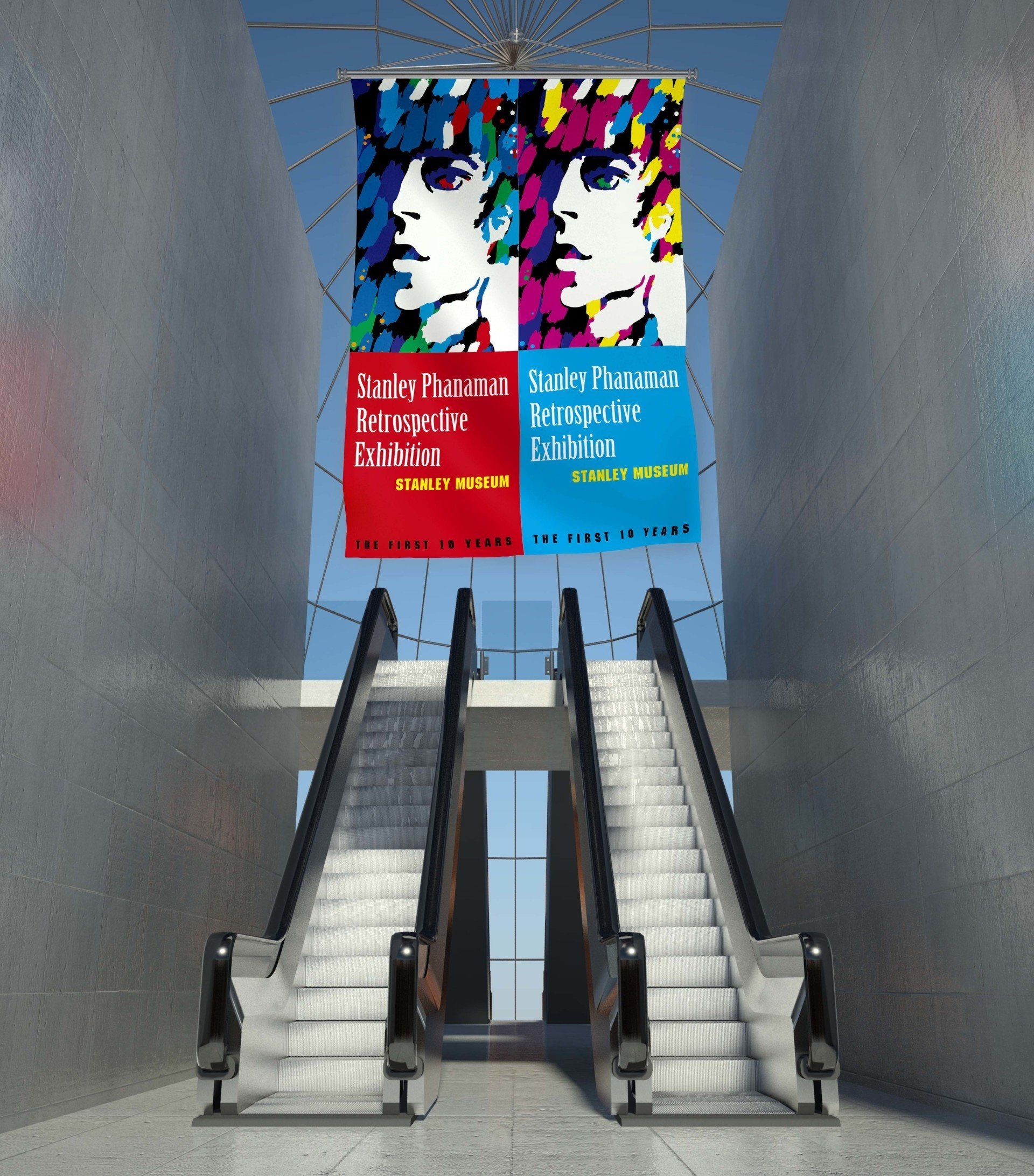 looking upwards two escalators with a large fabric graphic print hanging from ceiling