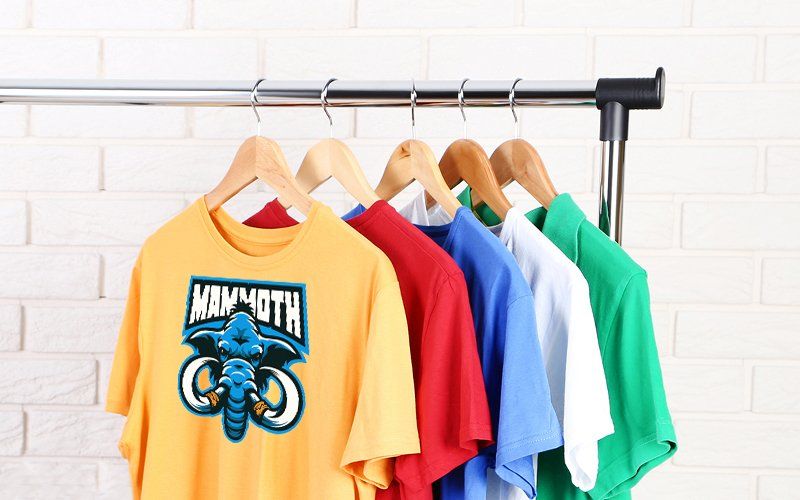 t-shirts hanging on a rack
