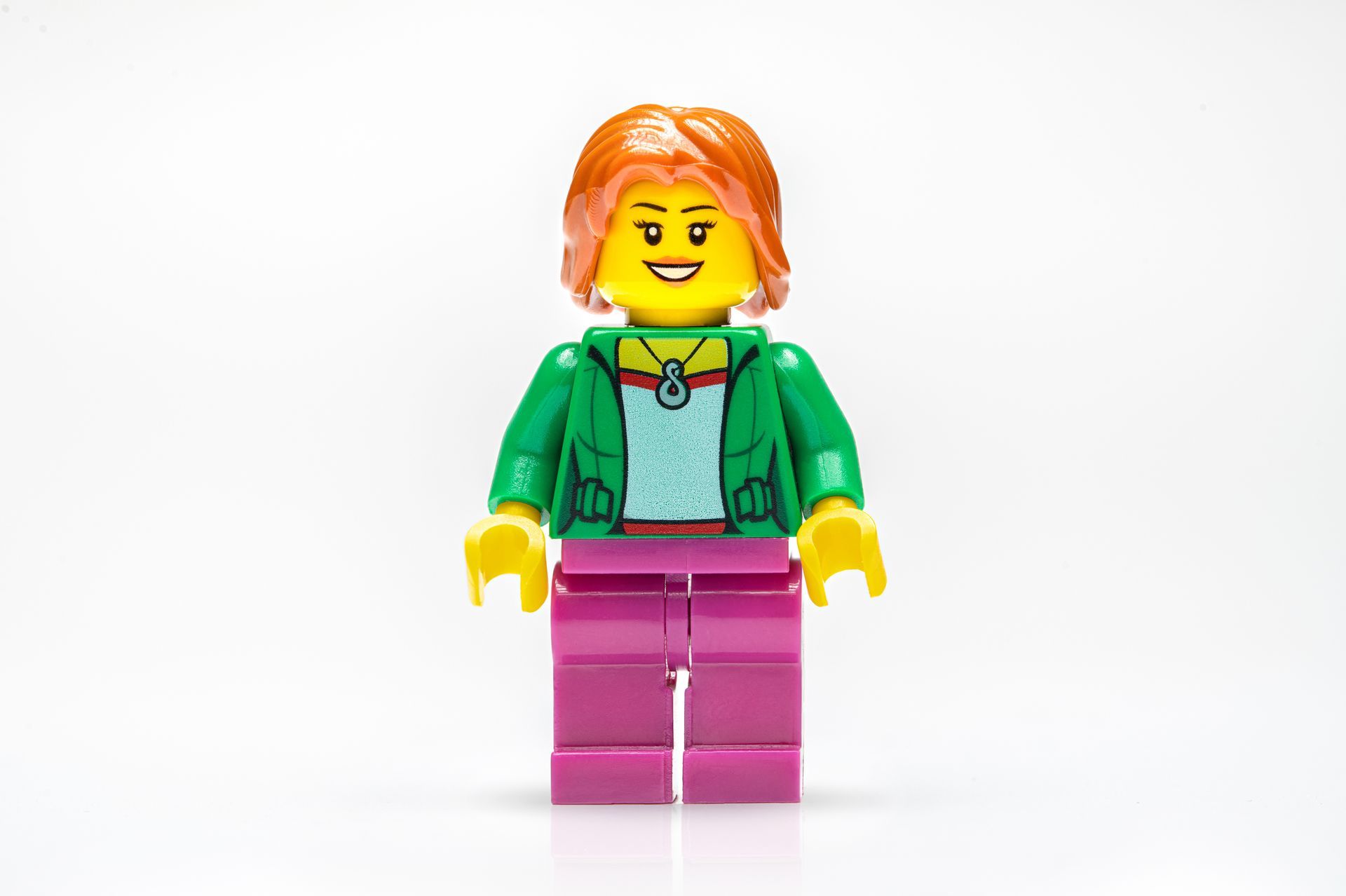 Lego figure with green top and pink legs