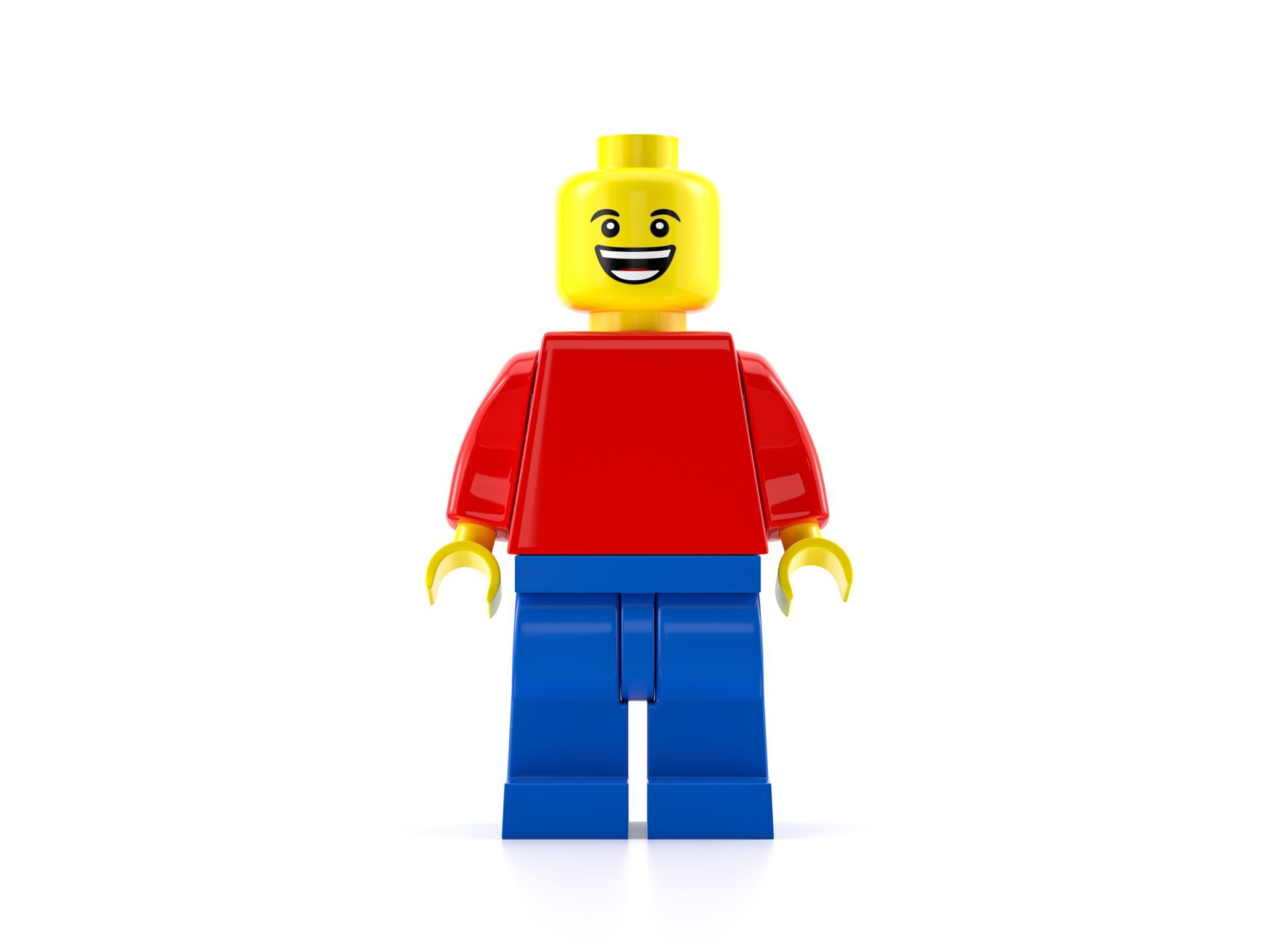 Lego figure smiling with red top and blue legs