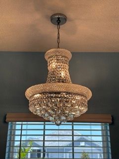 Three light bulbs are hanging from the ceiling in a dark room.