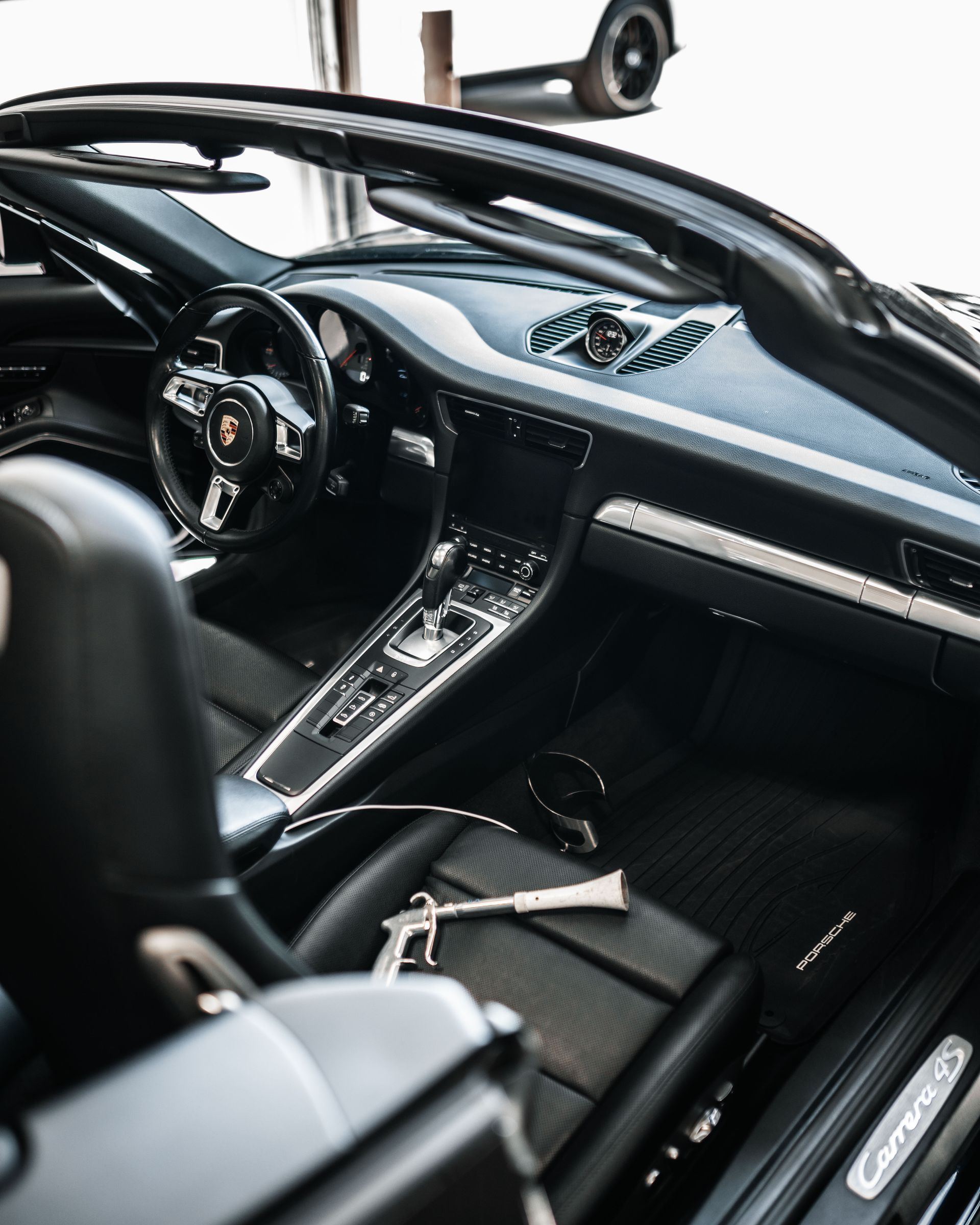 A close up of the interior of a convertible sports car.