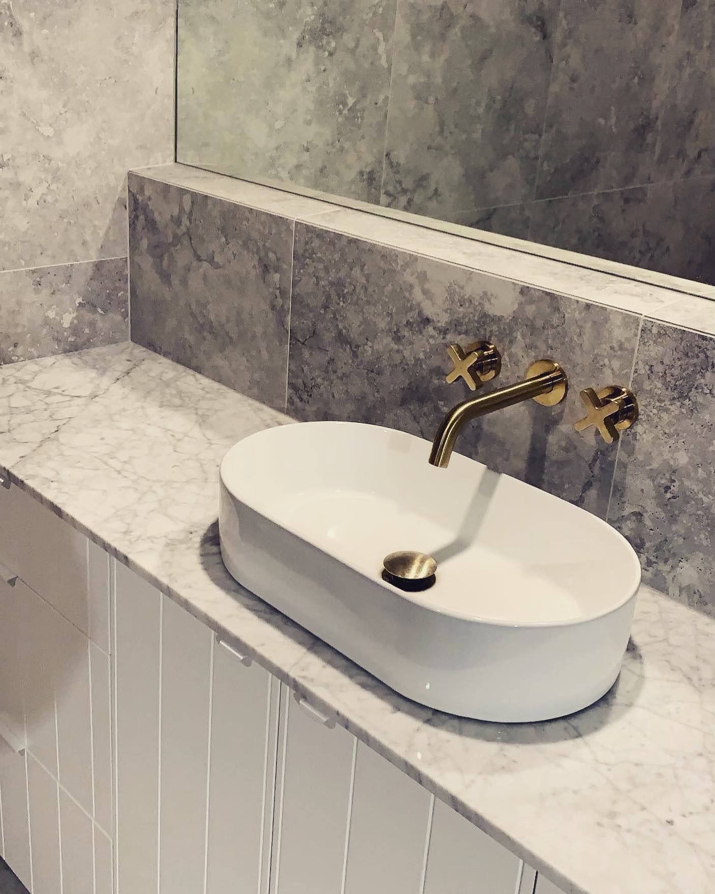 White Oval Sink on a Marble Countertop — Hot Water Specialist Forster In Forster, NSW