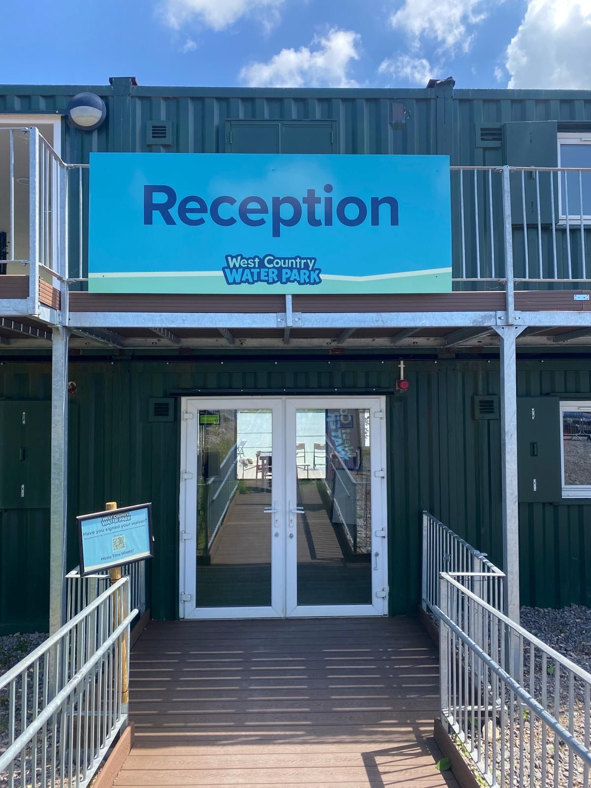 N3 Display Graphics | A green building with a blue sign that says reception