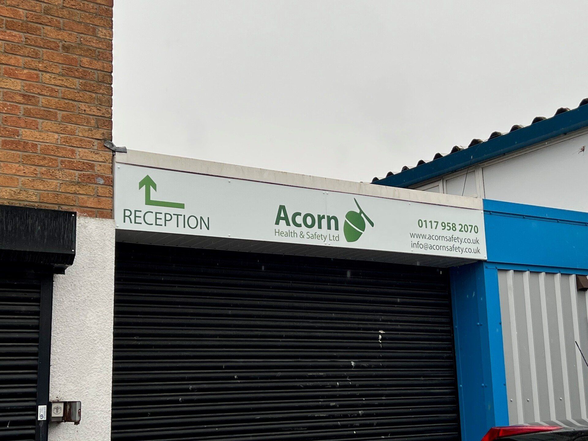 A sign on the side of a building that says acorn reception