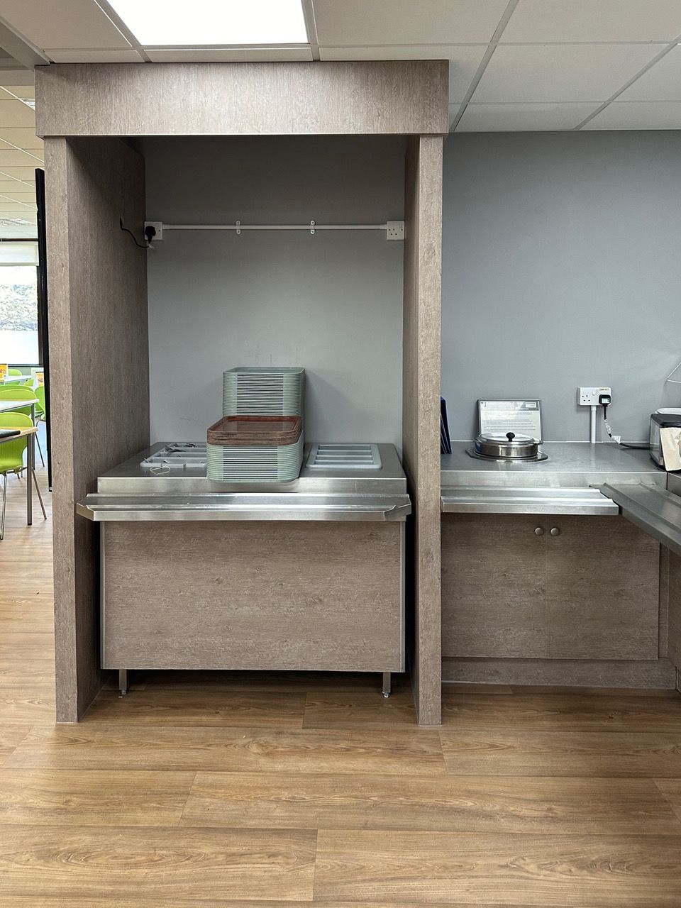 There is a stainless steel counter in the middle of the room.