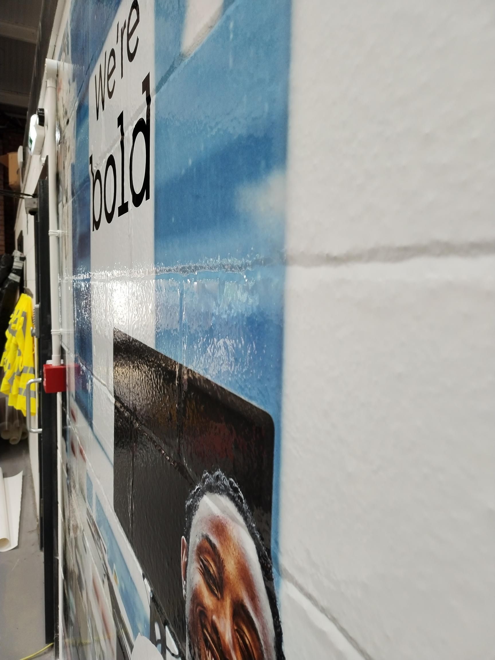 A sign on the side of a building that says we 're cold