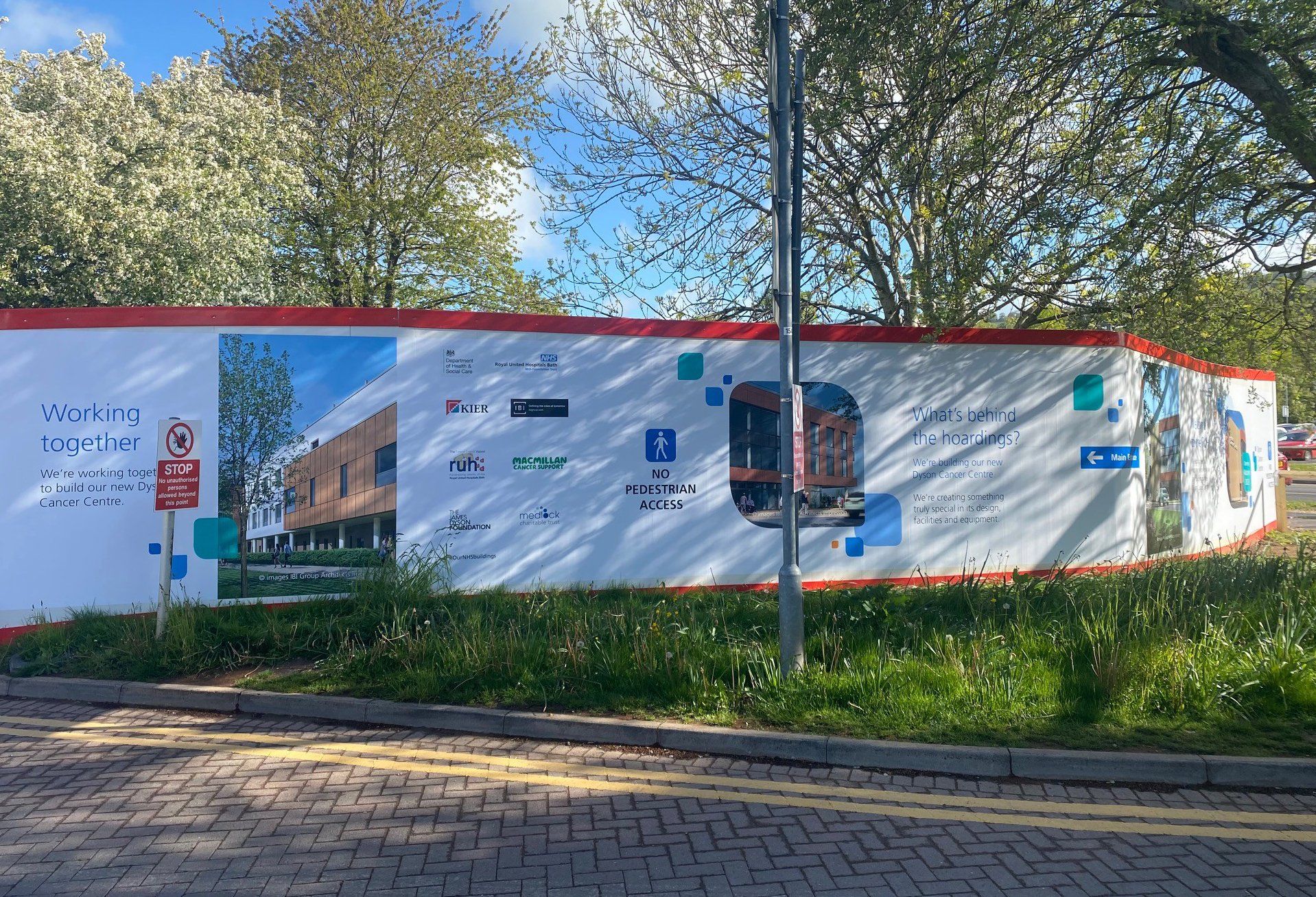 A white fence with a picture of a building on it
