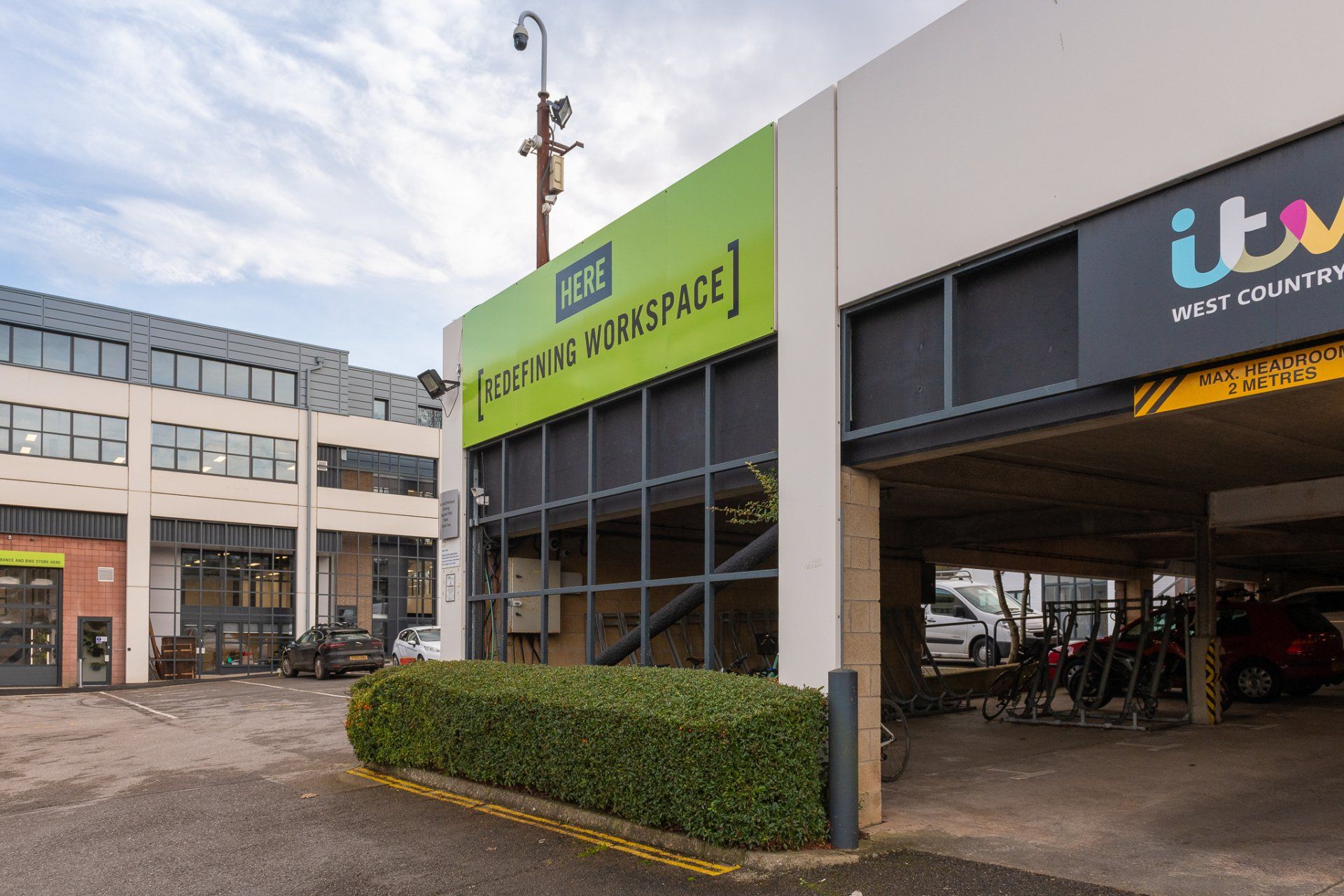 A building with a lot of windows and a sign that says itv on it.