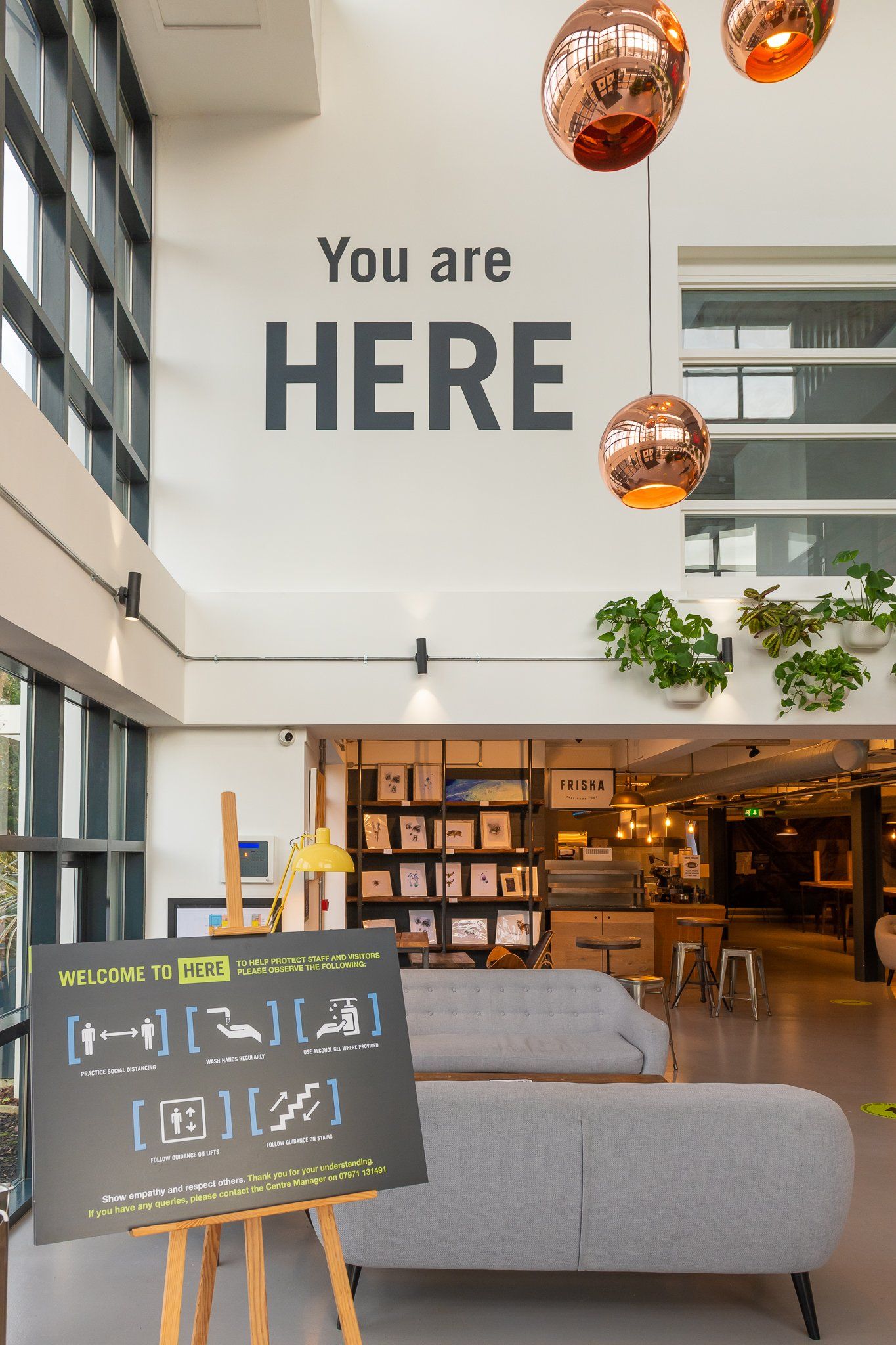 A sign on a wall that says you are here