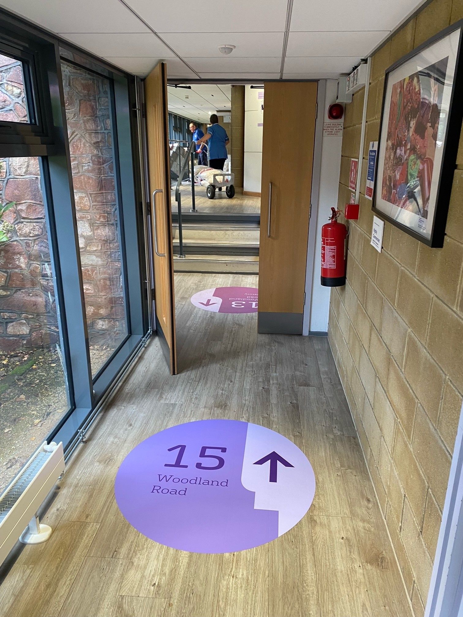 A hallway with a sign on the floor that says 15.