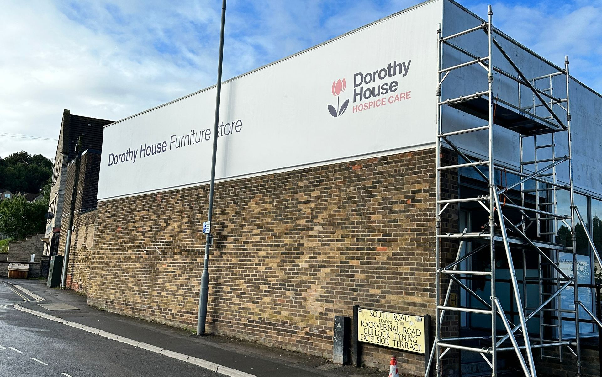 A large billboard on the side of a building that says dorothy house