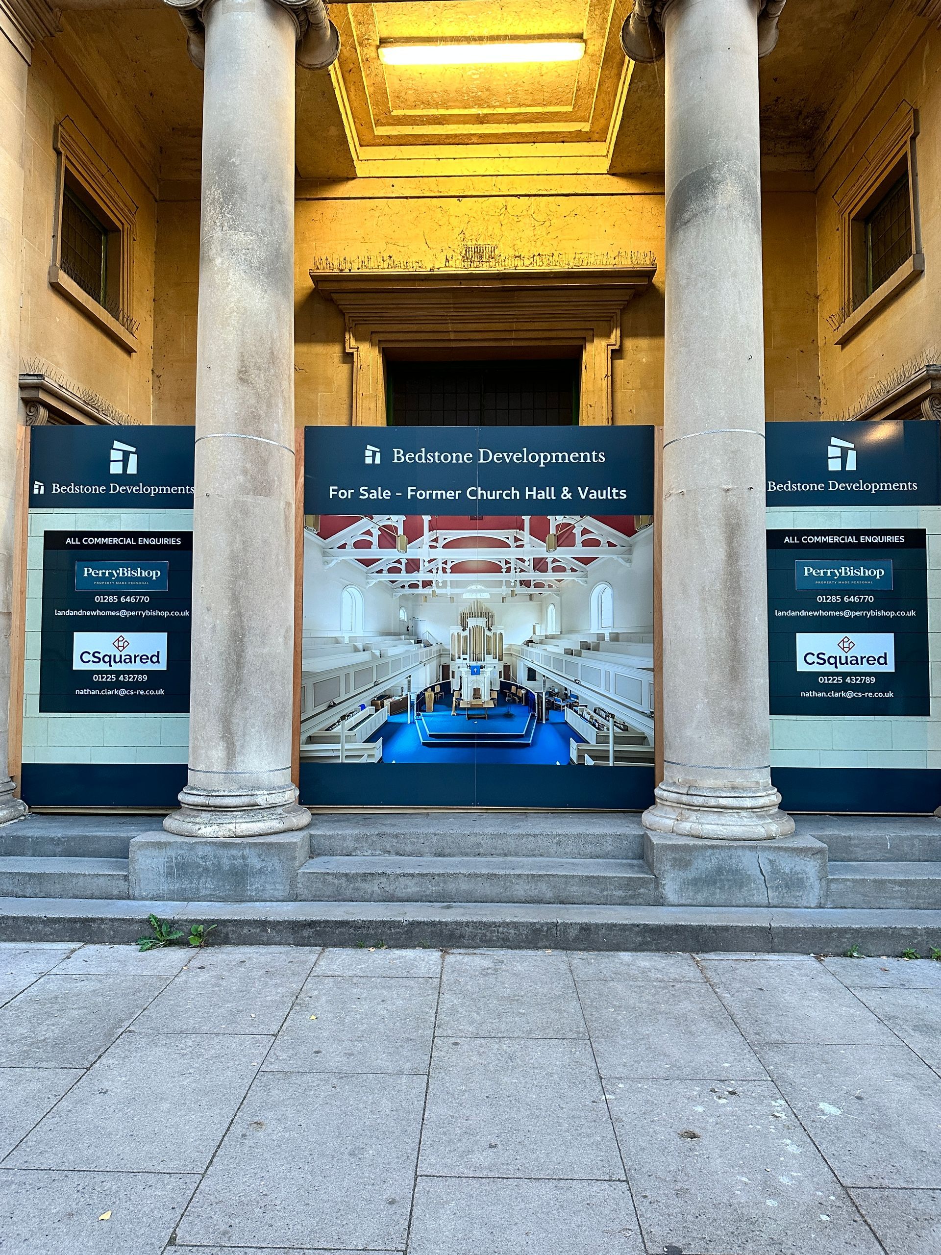 A building with columns and a sign that says ' a ' on it