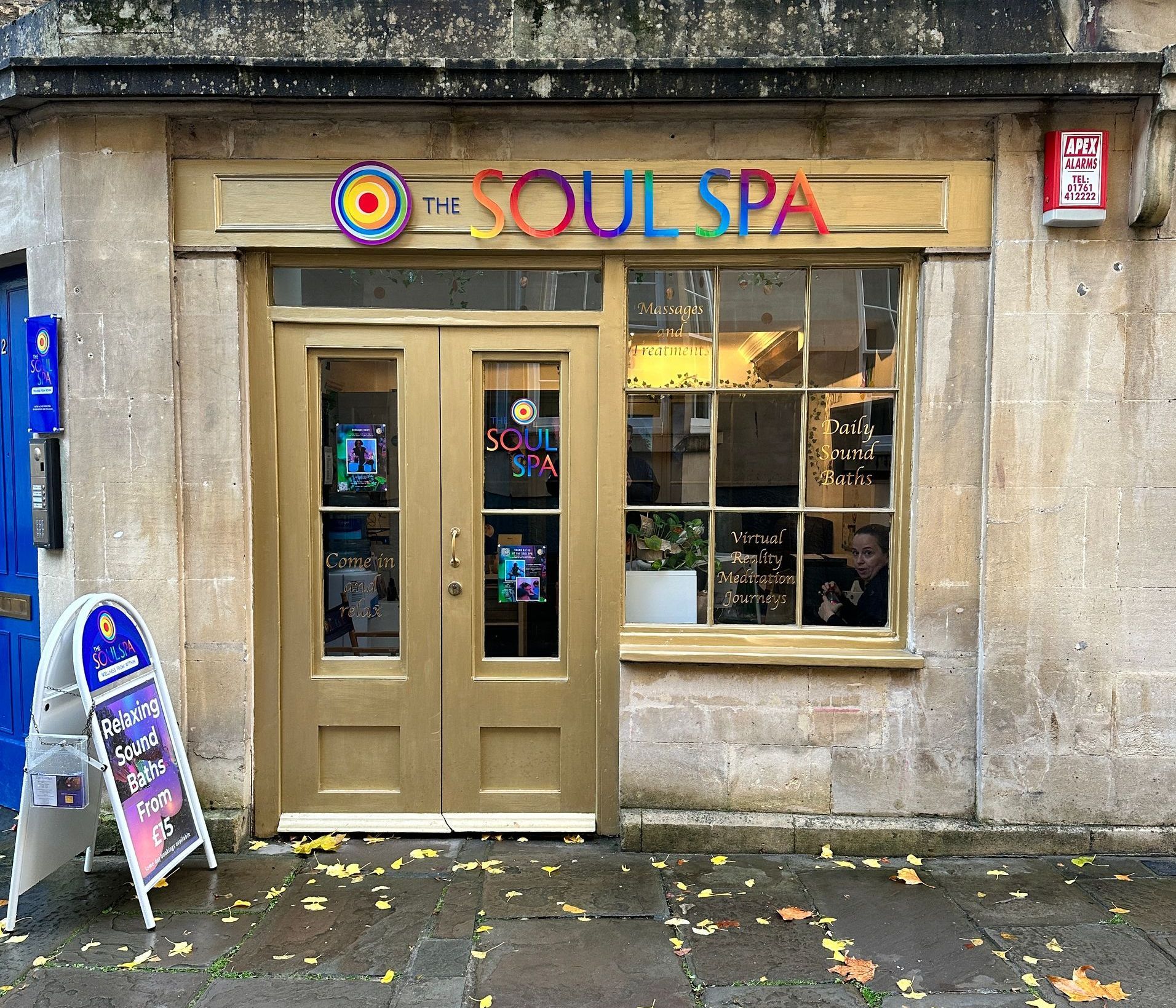 The front of a soul spa with a sign in front of it
