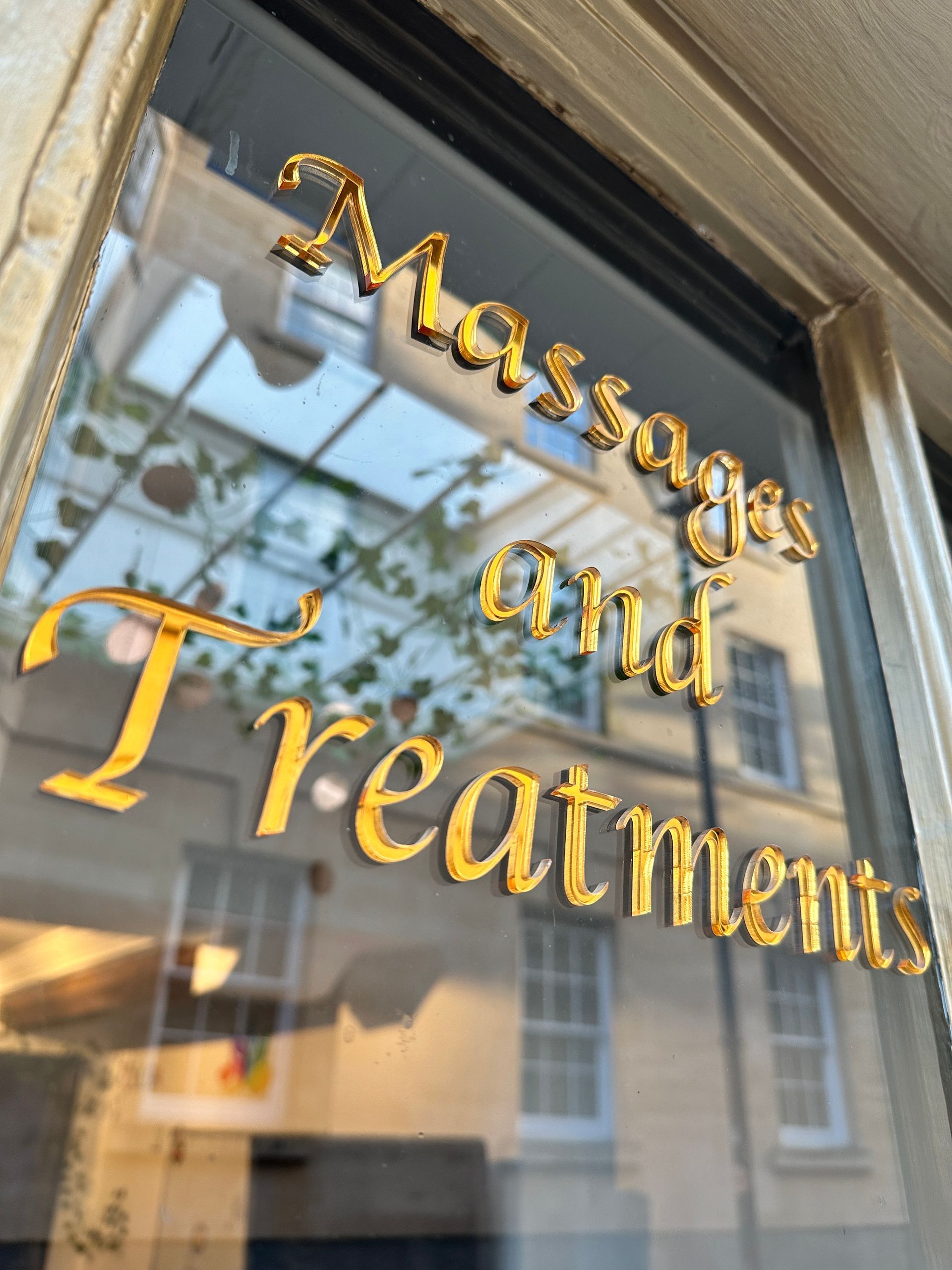 A sign that says massages and treatments on it