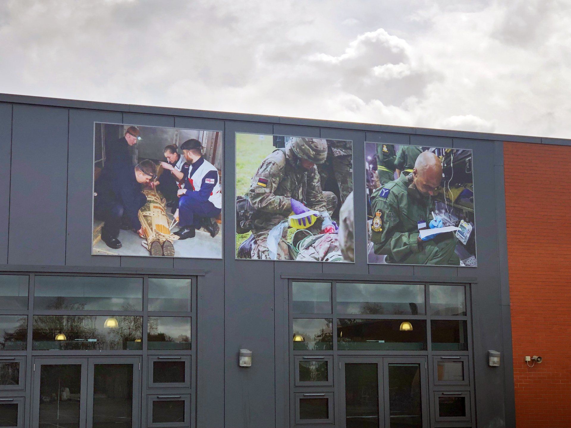 A building with pictures of soldiers on the side of it.