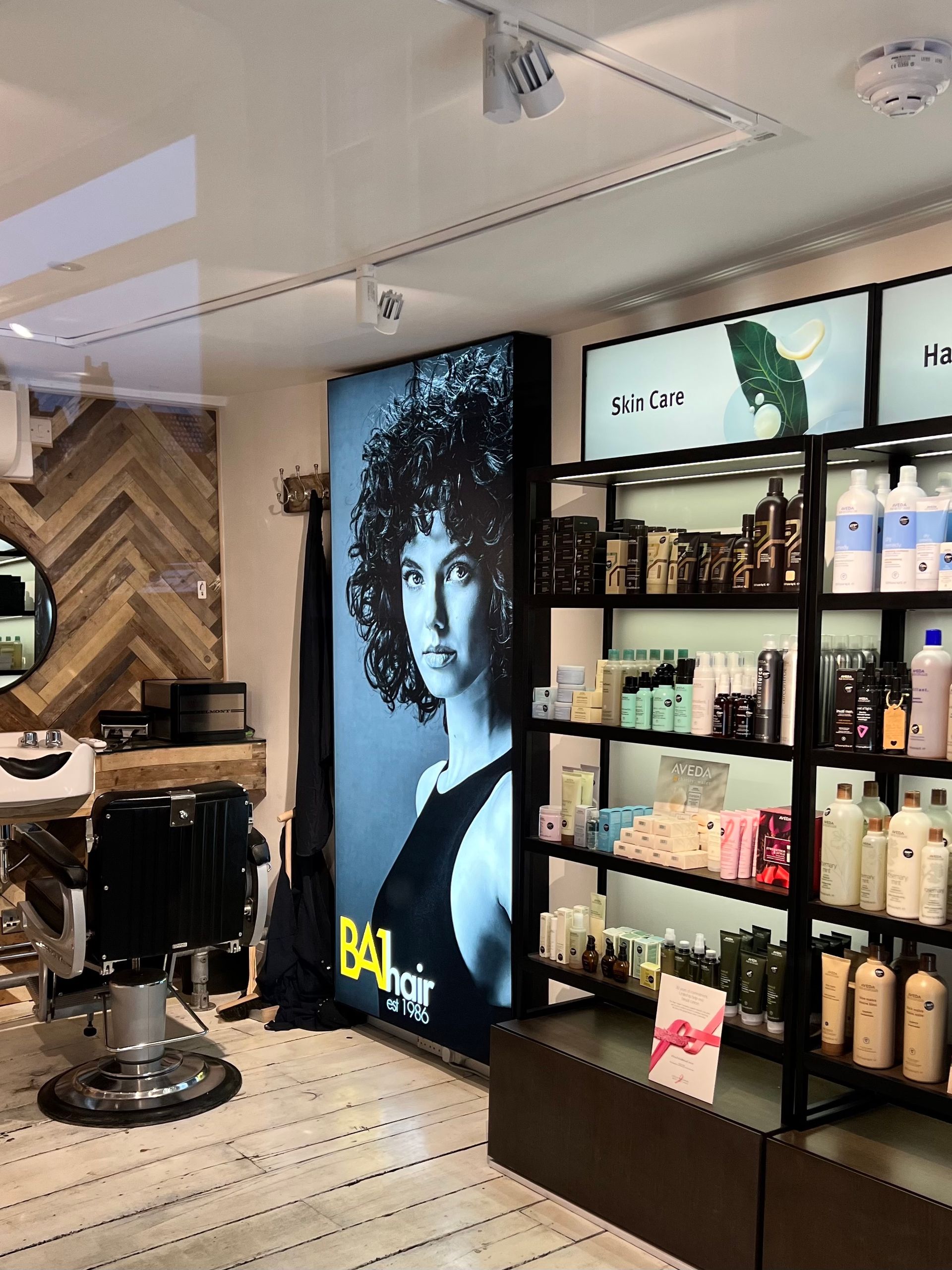 A salon with a picture of a woman on the wall