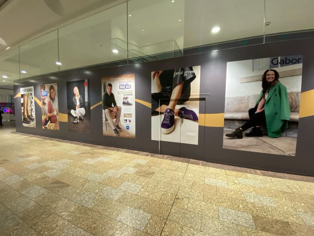 A large wall with a lot of pictures on it.