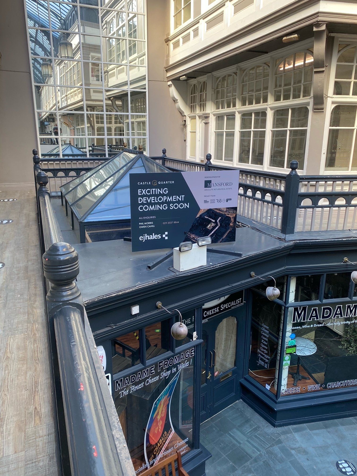 An aerial view of a building with a sign on the roof.