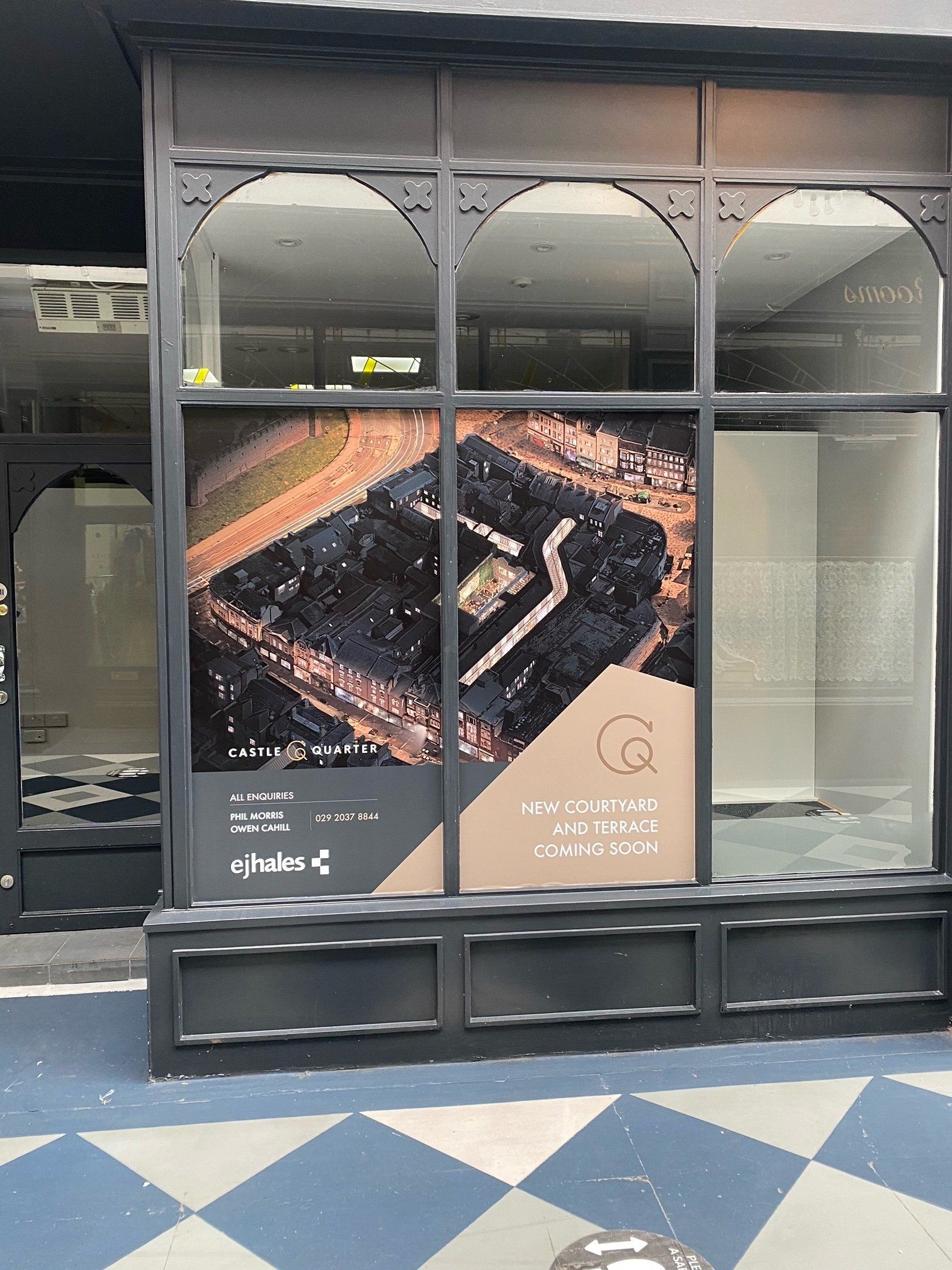 A window with a picture of a building on it.