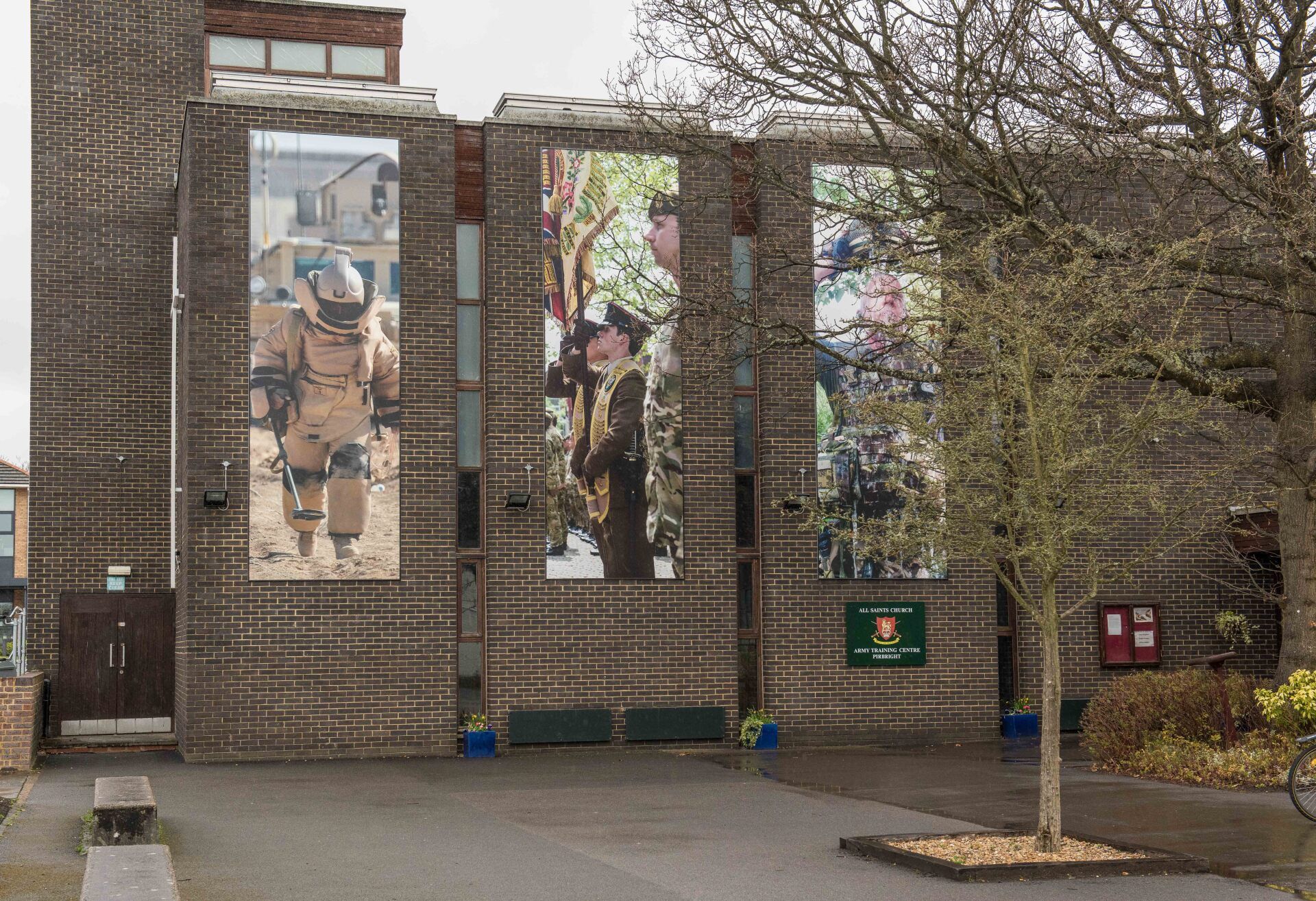 A building with a lot of pictures on the side of it