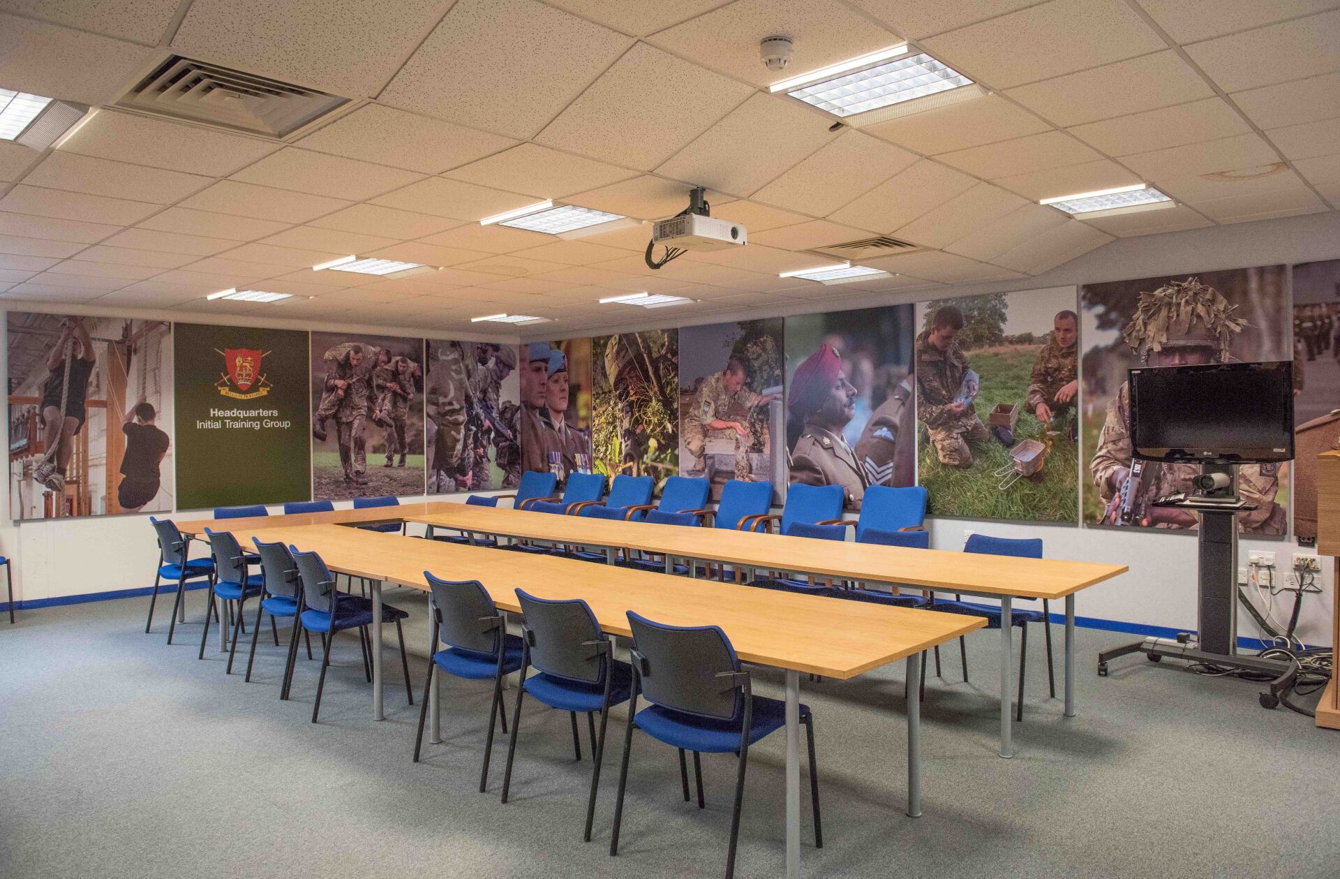 A conference room with a long table and chairs