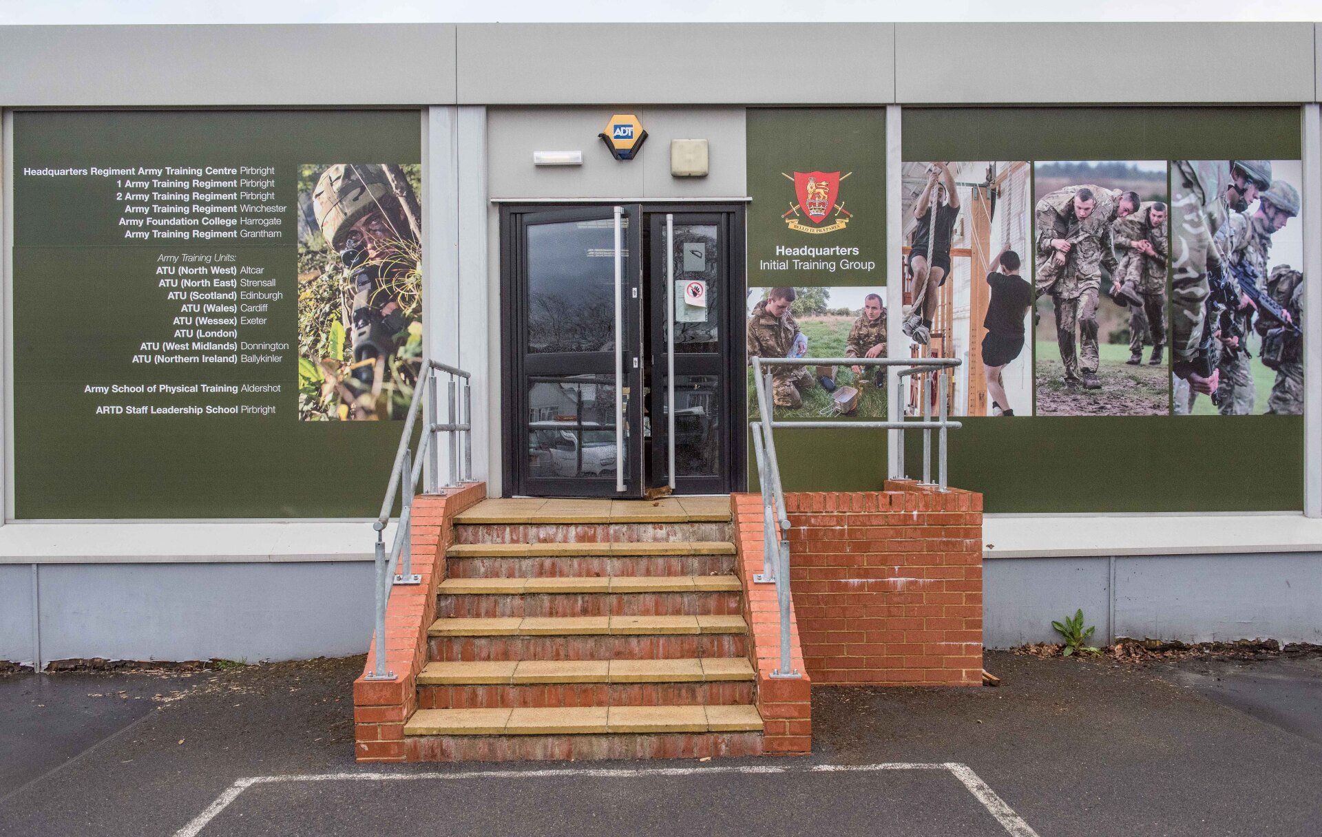 The front of a building with stairs leading up to it