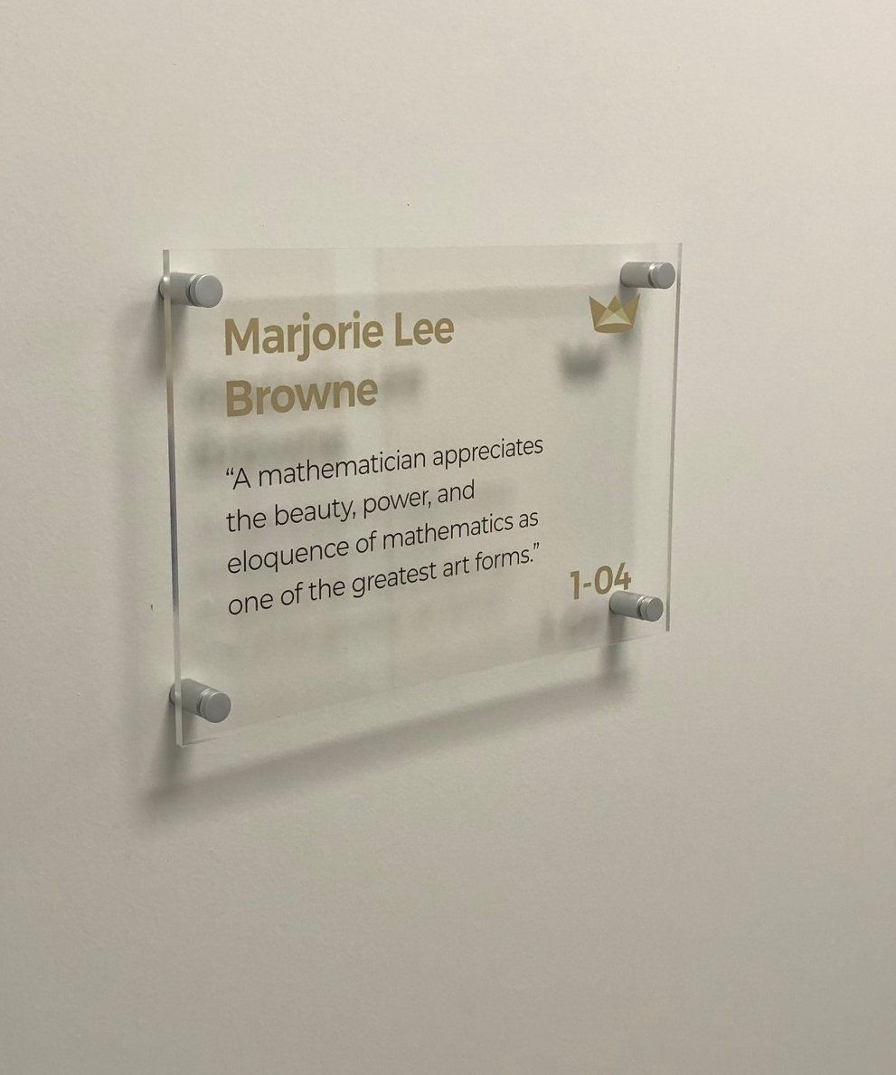 A sign on a wall that says marjorie lee browne on it.