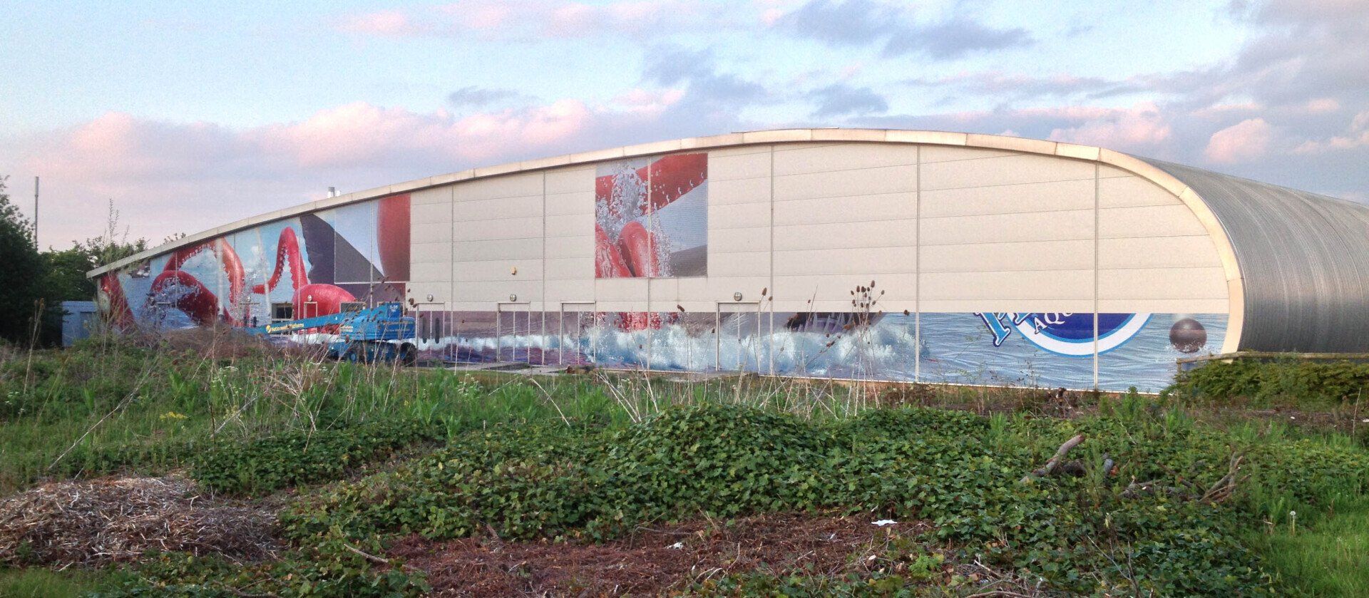 A large building with graffiti on the side of it.