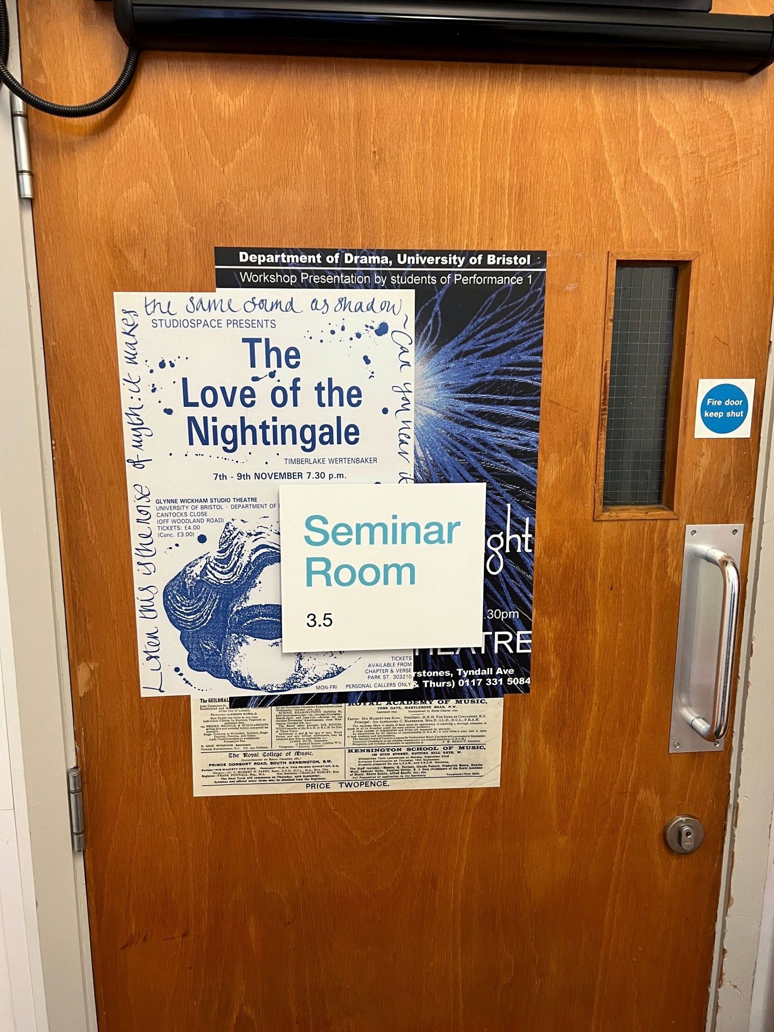 A wooden door with a seminar room sign on it