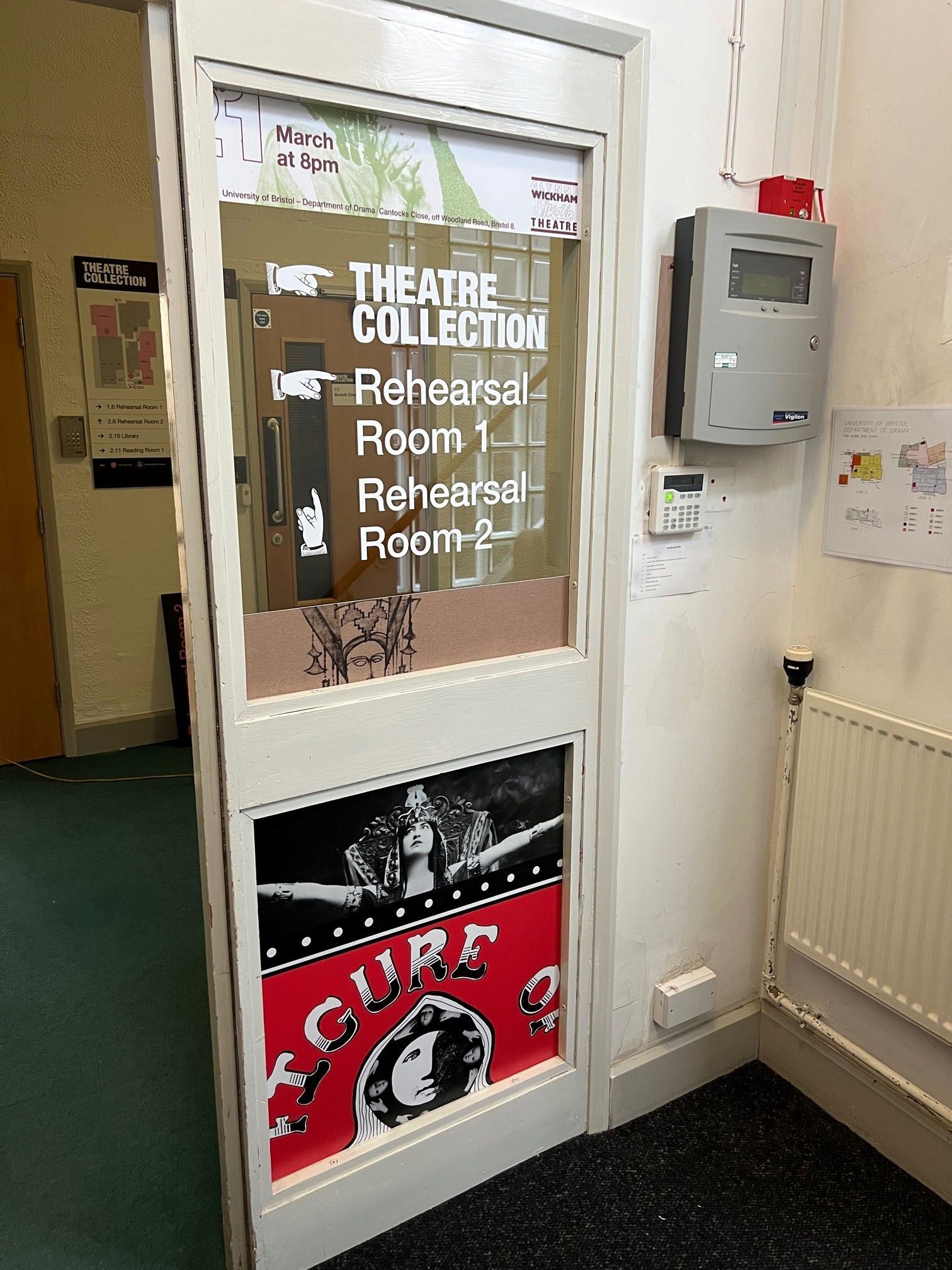 A door with a sign on it that says theatre collection