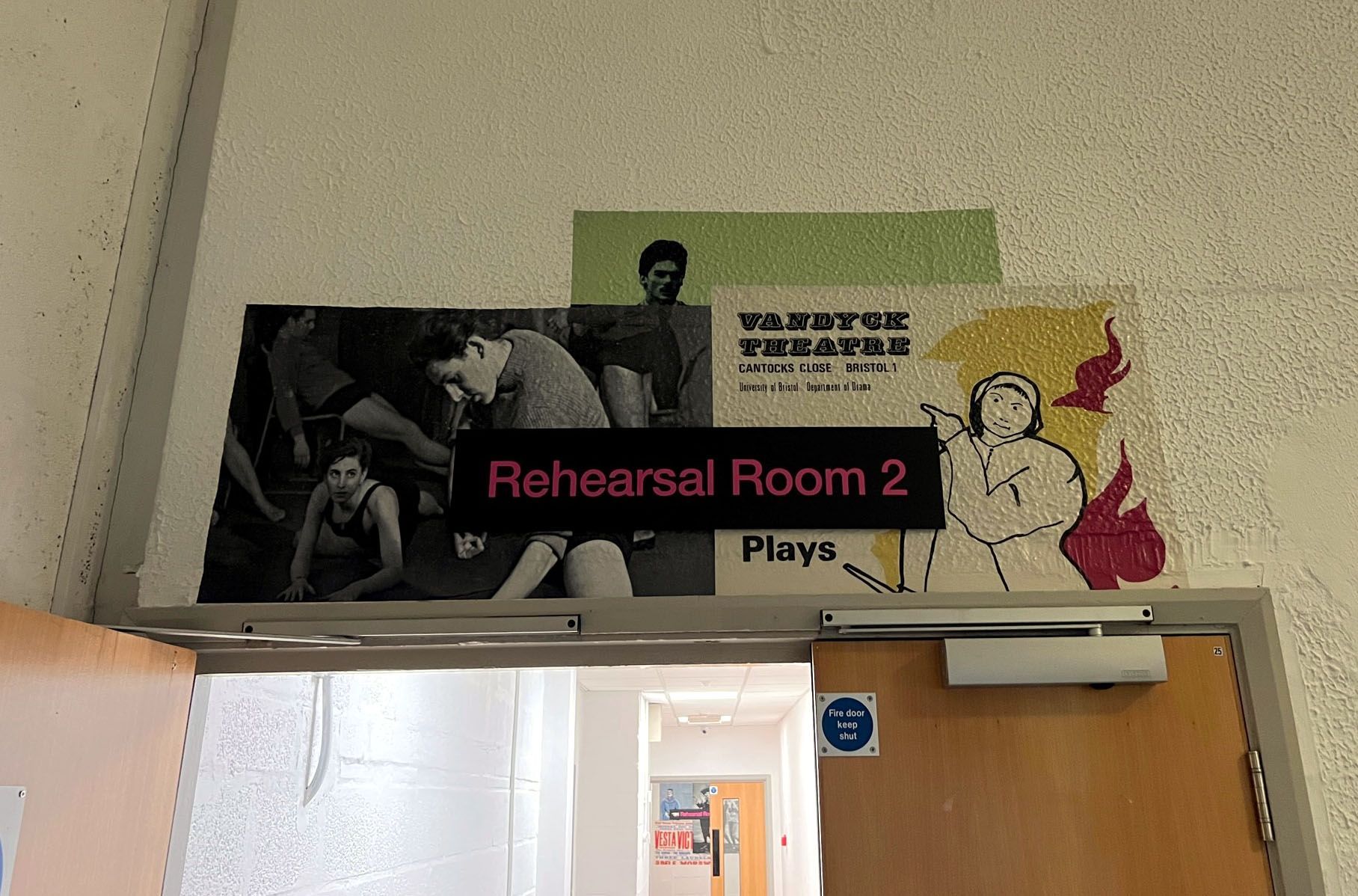 A doorway with a sign that says rehearsal room 2