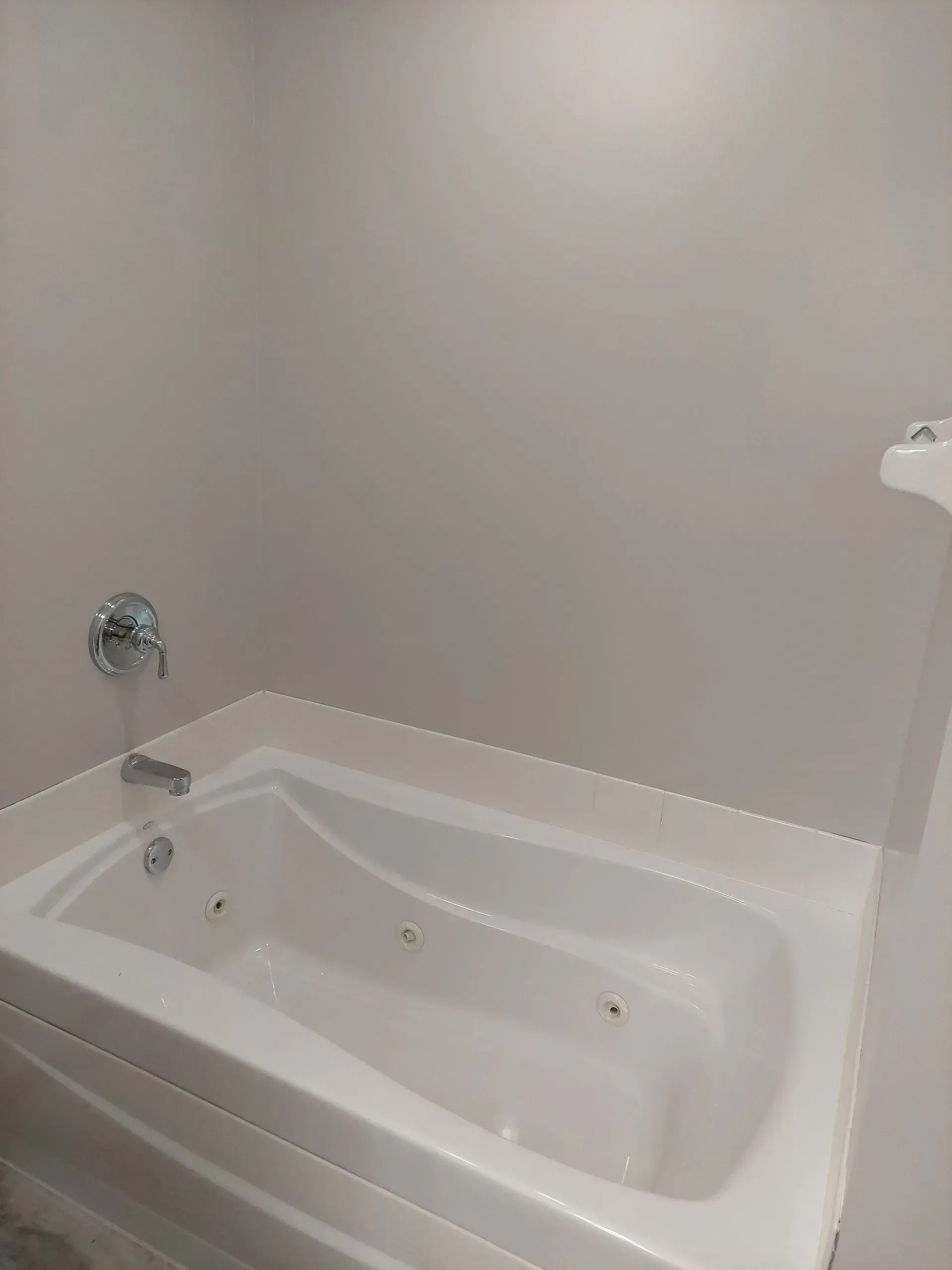 A bathroom with a jacuzzi tub and a shower.