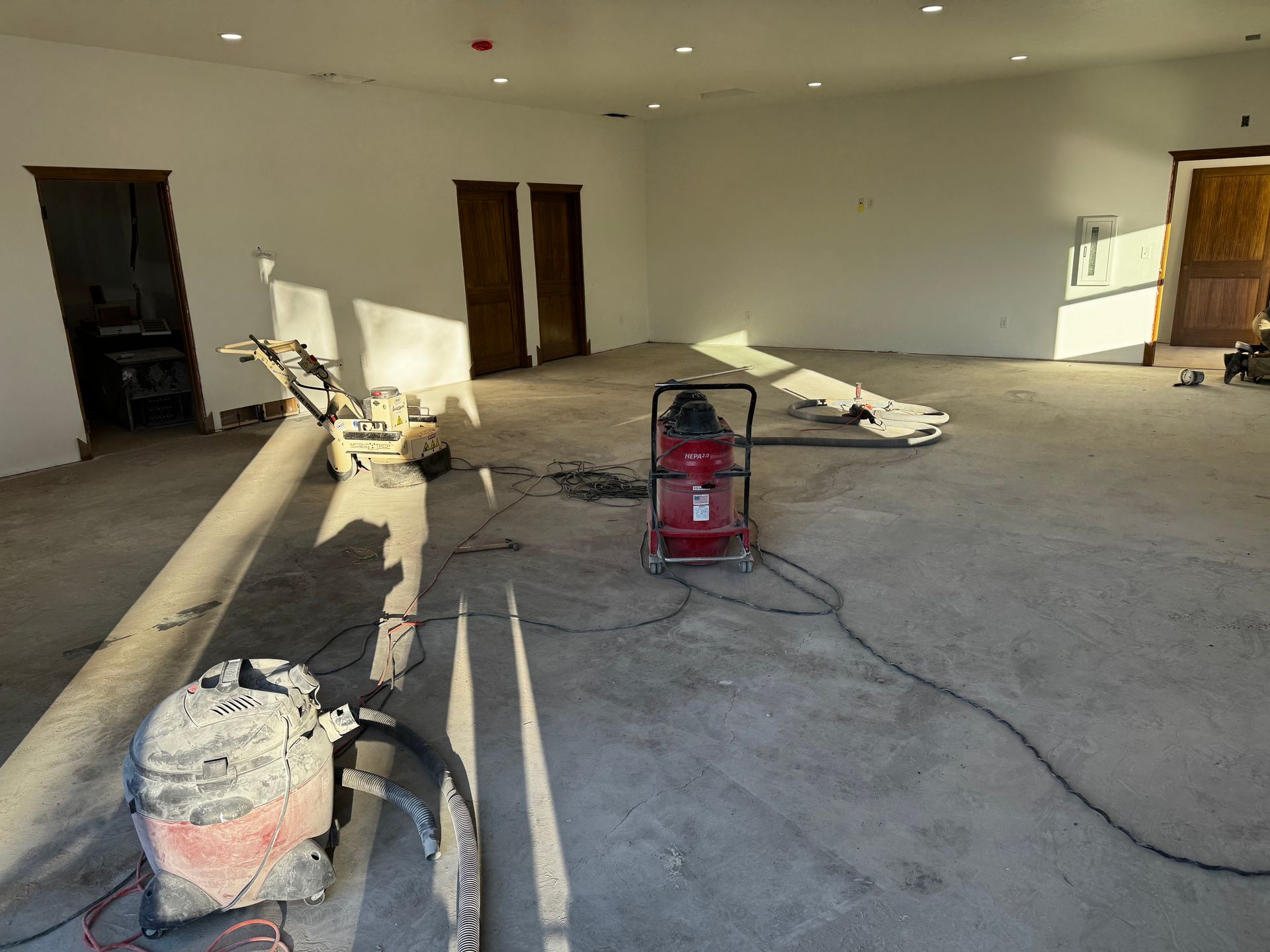 A vacuum cleaner is sitting on the floor of a room.