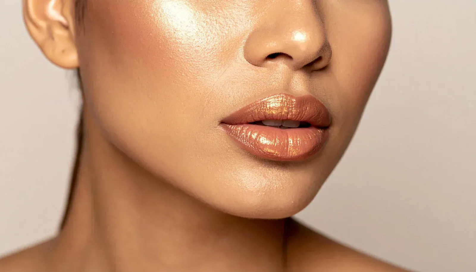 Doctor in white coat with stethoscope, taking notes on a clipboard while consulting with a patient.