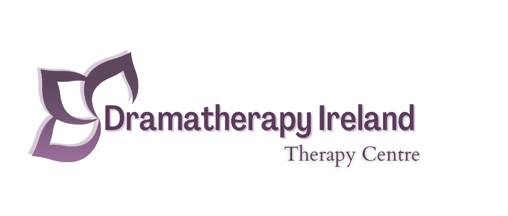 The logo for dramatherapy ireland therapy centre is purple and white. Dramatherapy Ireland