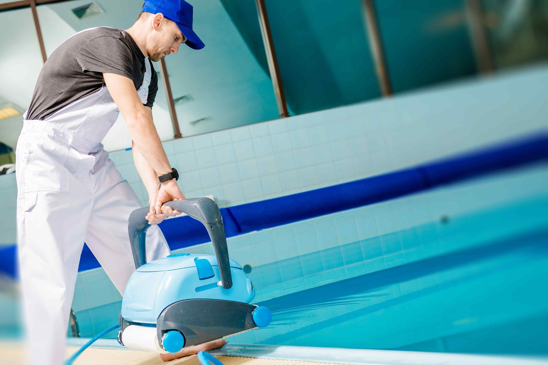 a worker is giving the pool service