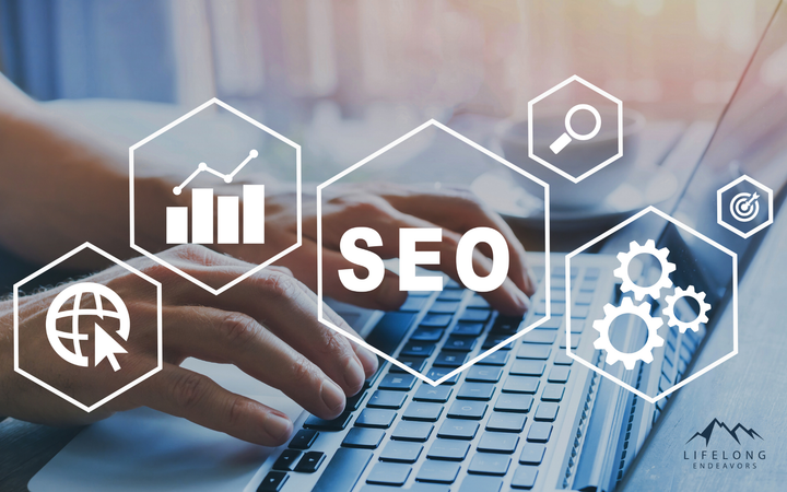 A person is typing on a laptop computer with the word seo surrounded by icons.