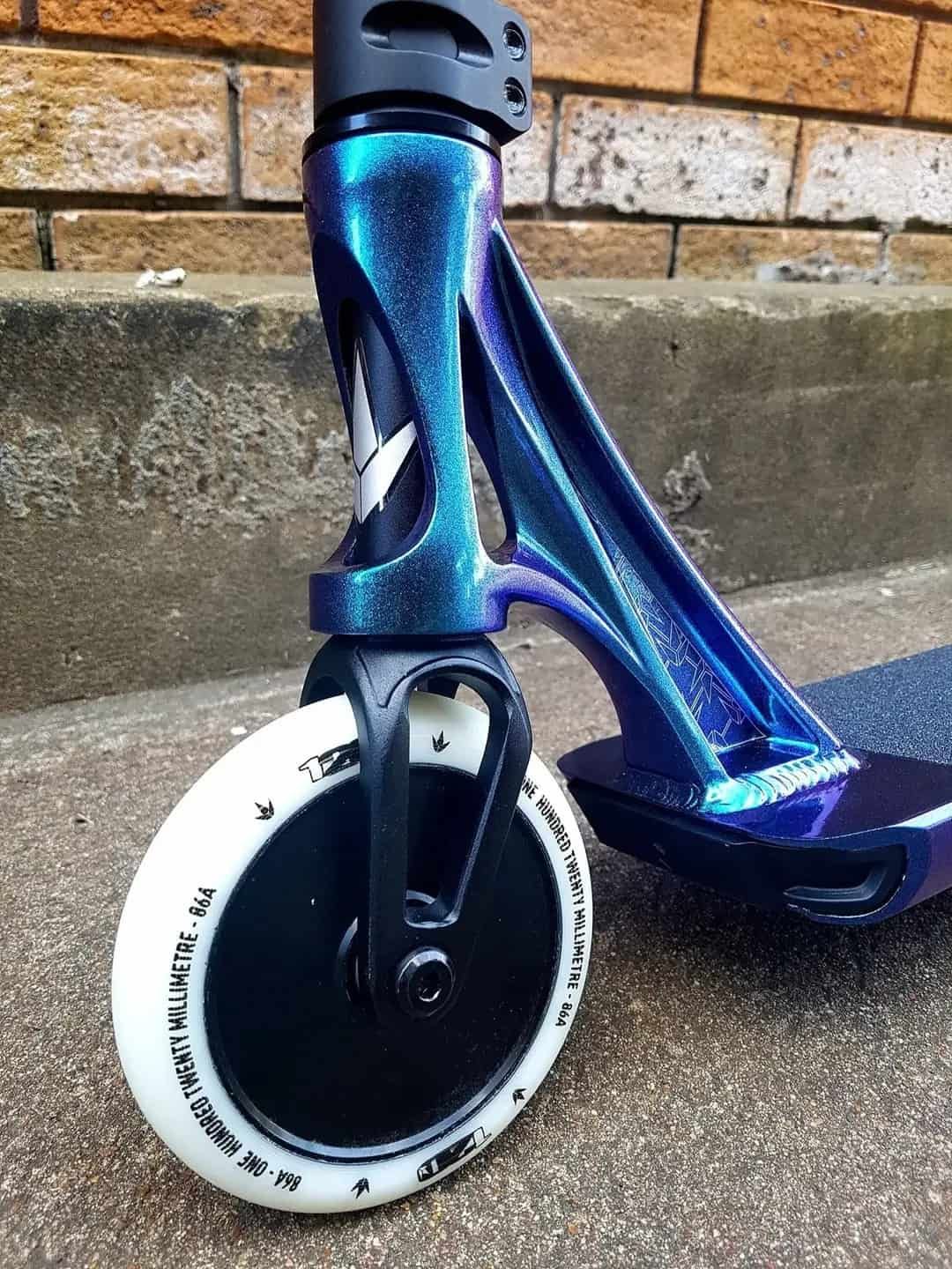 A Close Up Of A Scooter 's Front Wheel On A Sidewalk — Active Cycles In Raymond Terrace, NSW