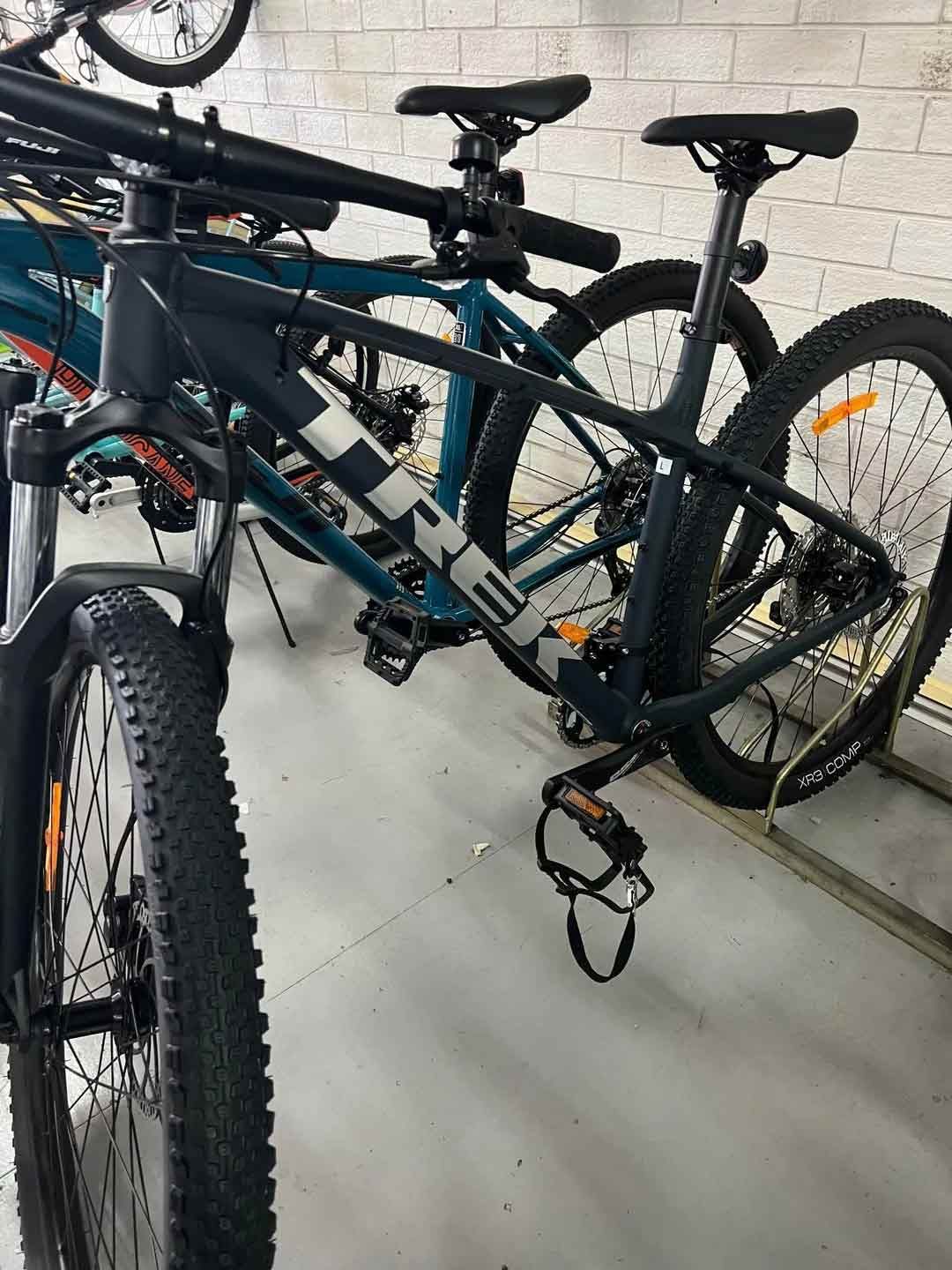 A Row Of Bicycles Are Parked Next To Each Other In A Garage — Active Cycles In Raymond Terrace, NSW