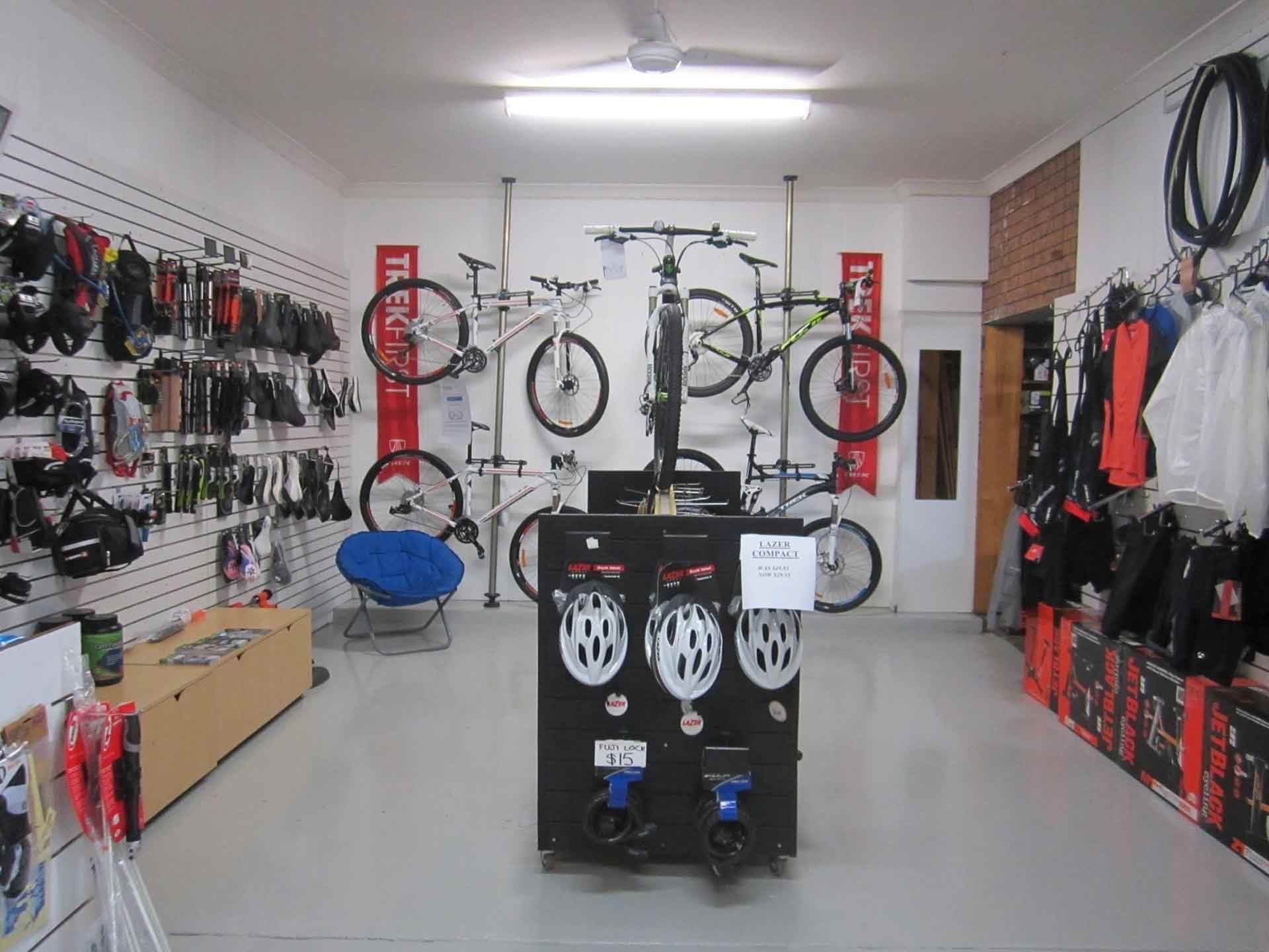 A Bicycle Shop With A Lot Of Bicycles Hanging On The Wall — Active Cycles In Raymond Terrace, NSW