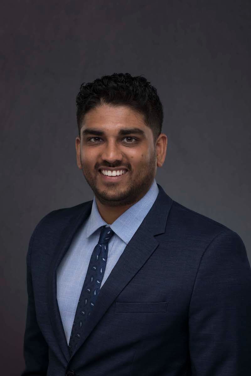 Corporate headshot of a young Indian CEO