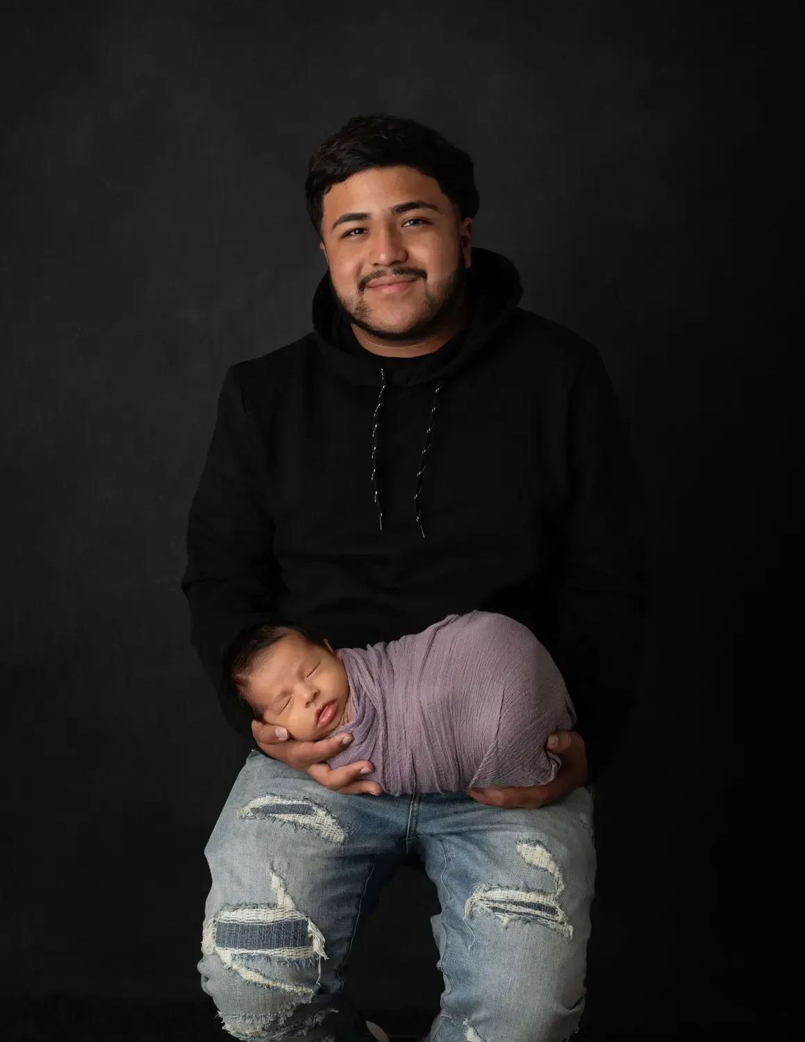 Glendale newborn and siblings Brother with newborn brother.