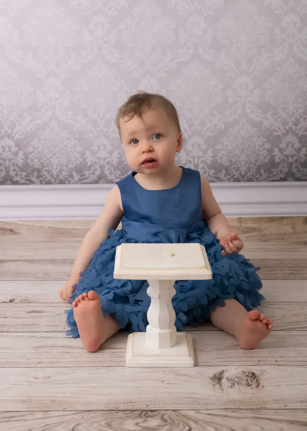 First birthday girl photoshoot in blue dress.